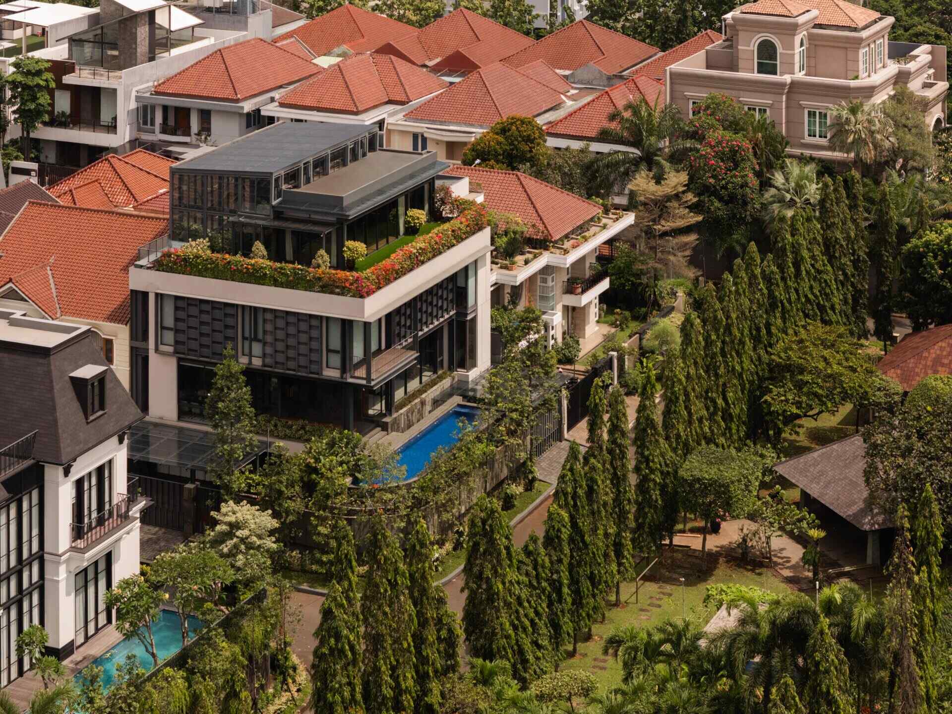 Explore Beyond The Courtyard House by RCAB Studio in Jakarta, where steel, timber and tropical gardens come together in a modern home designed around an inner courtyard.