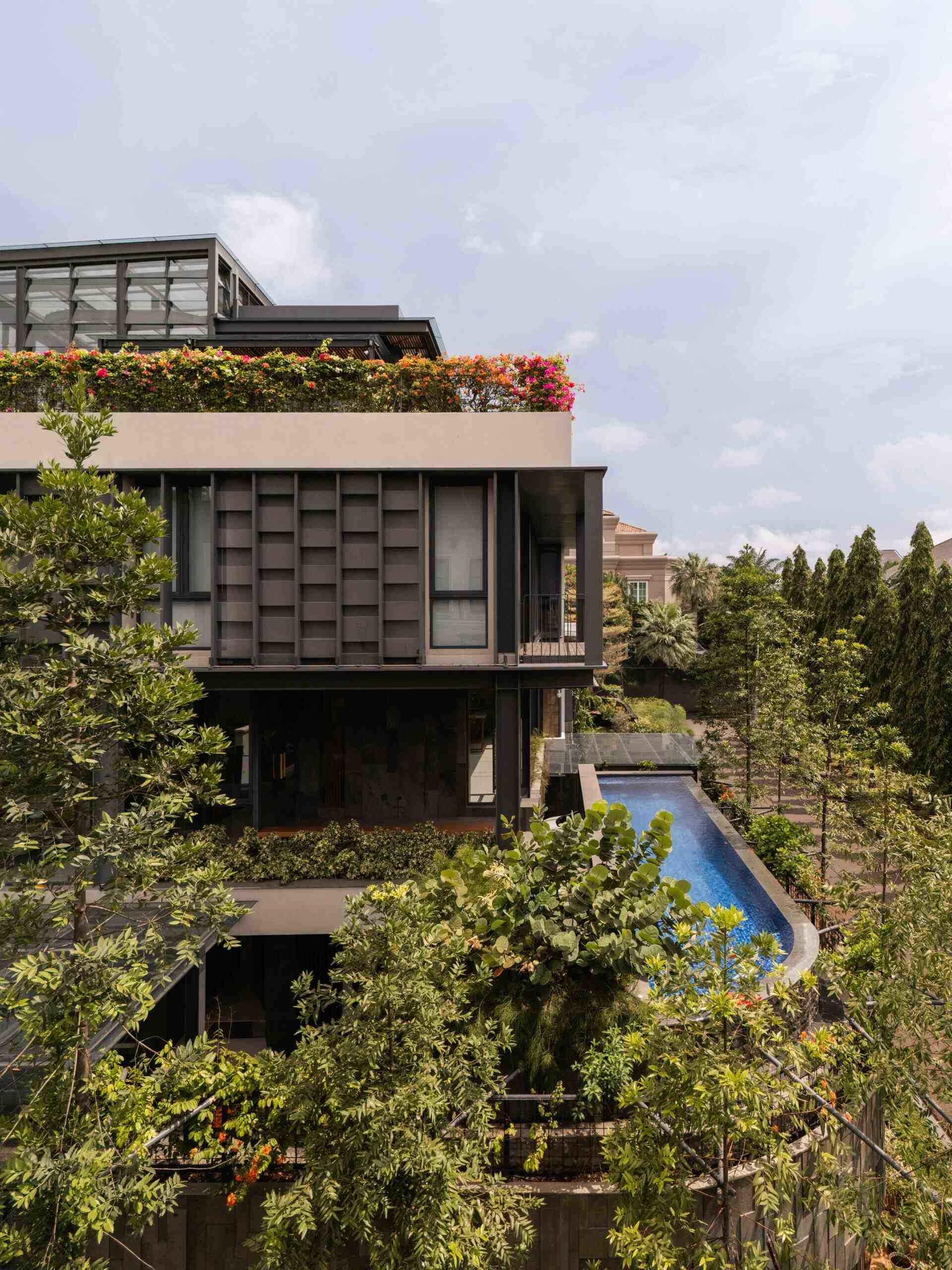 Explore Beyond The Courtyard House by RCAB Studio in Jakarta, where steel, timber and tropical gardens come together in a modern home designed around an inner courtyard.
