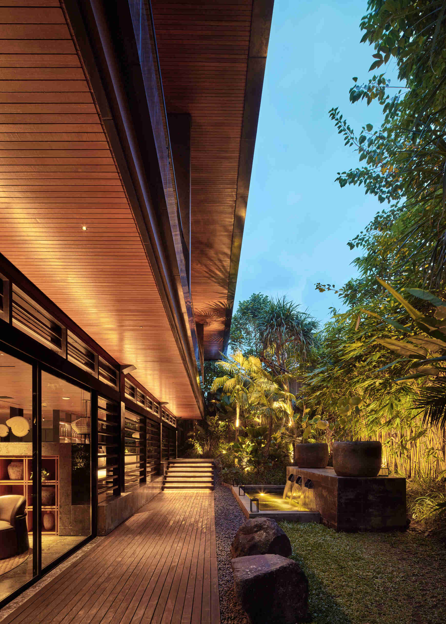 Gardens and winding pathways surround Villa Suki, creating beautiful outdoor spaces at every edge of the home.