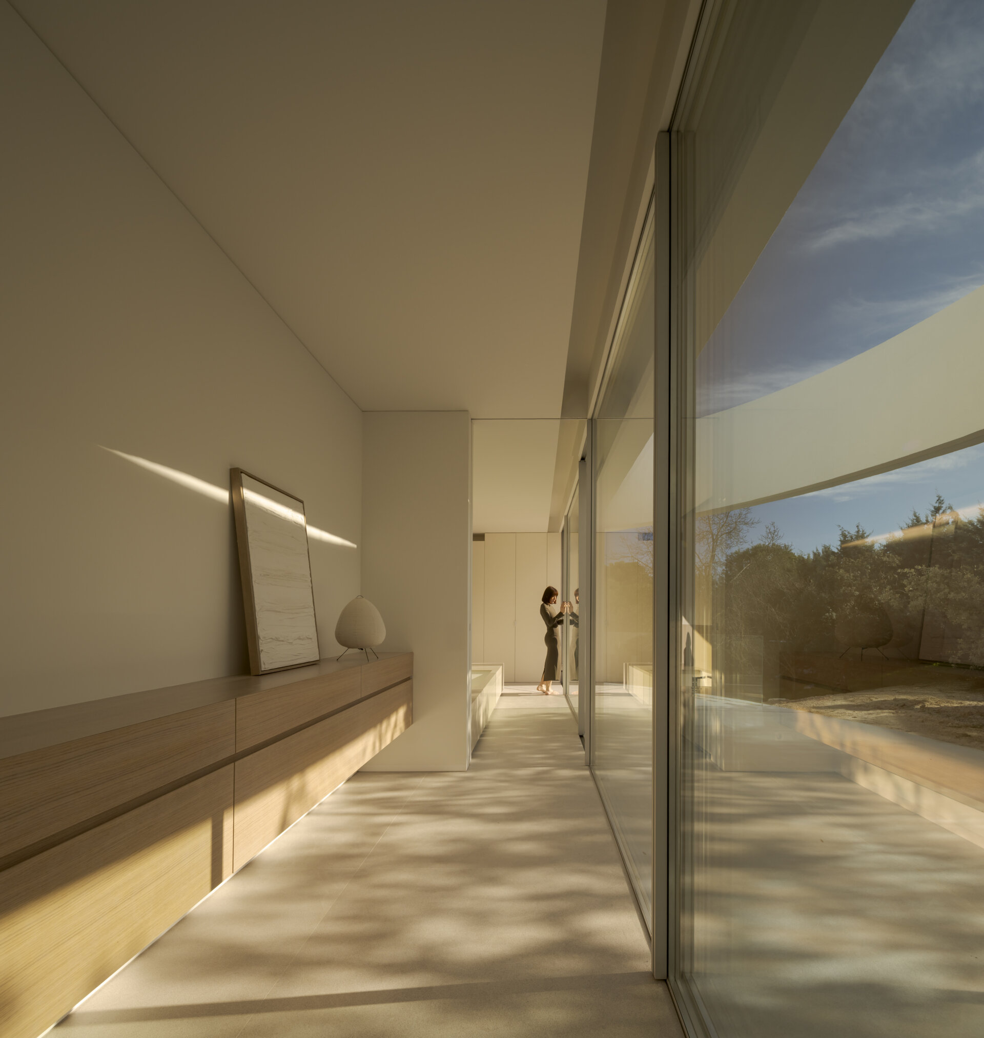 Large glass walls frame spectacular views of the Sierra de Guadarrama while filling this contemporary home with natural light.