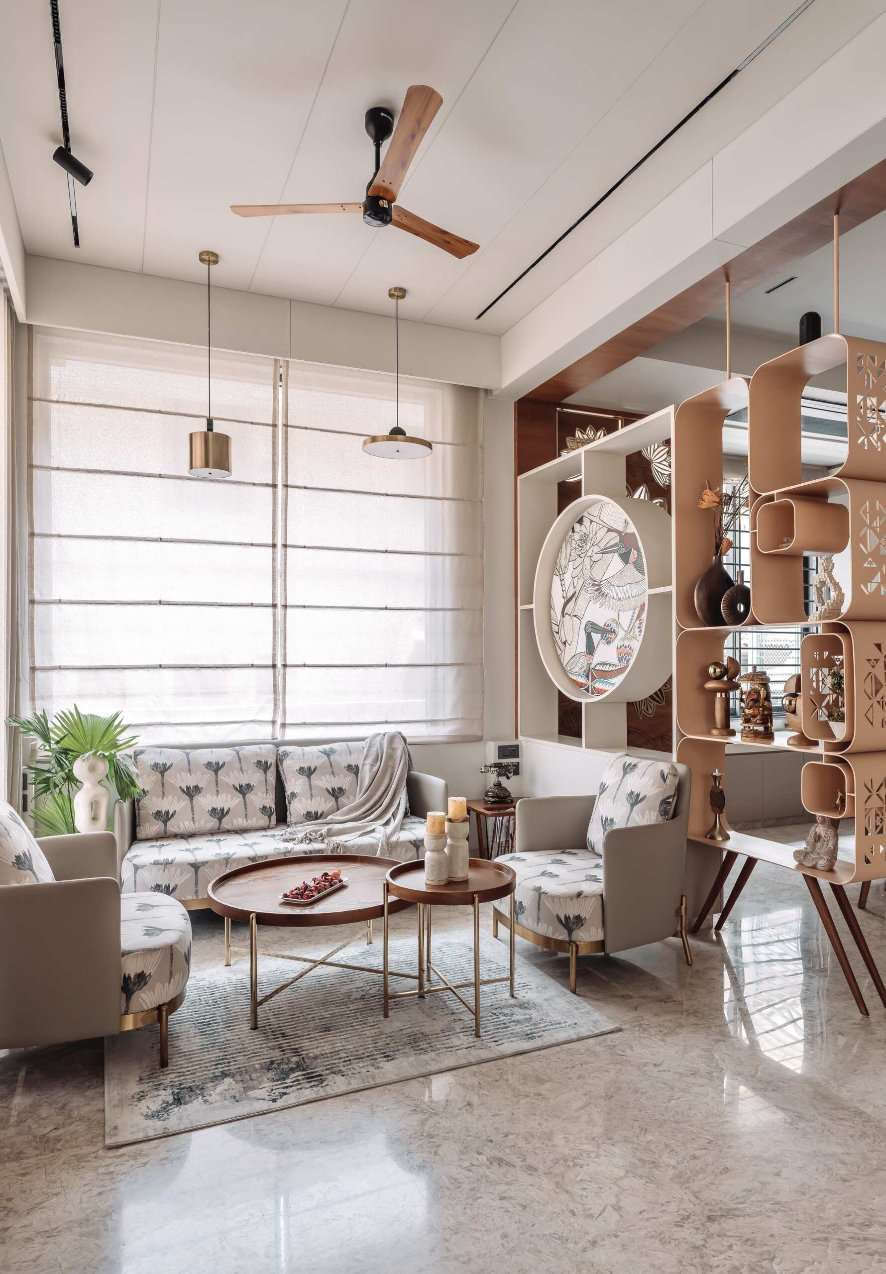 This shared office lounge combines decorative screens, custom shelving and carved details to create a practical yet inviting family space.