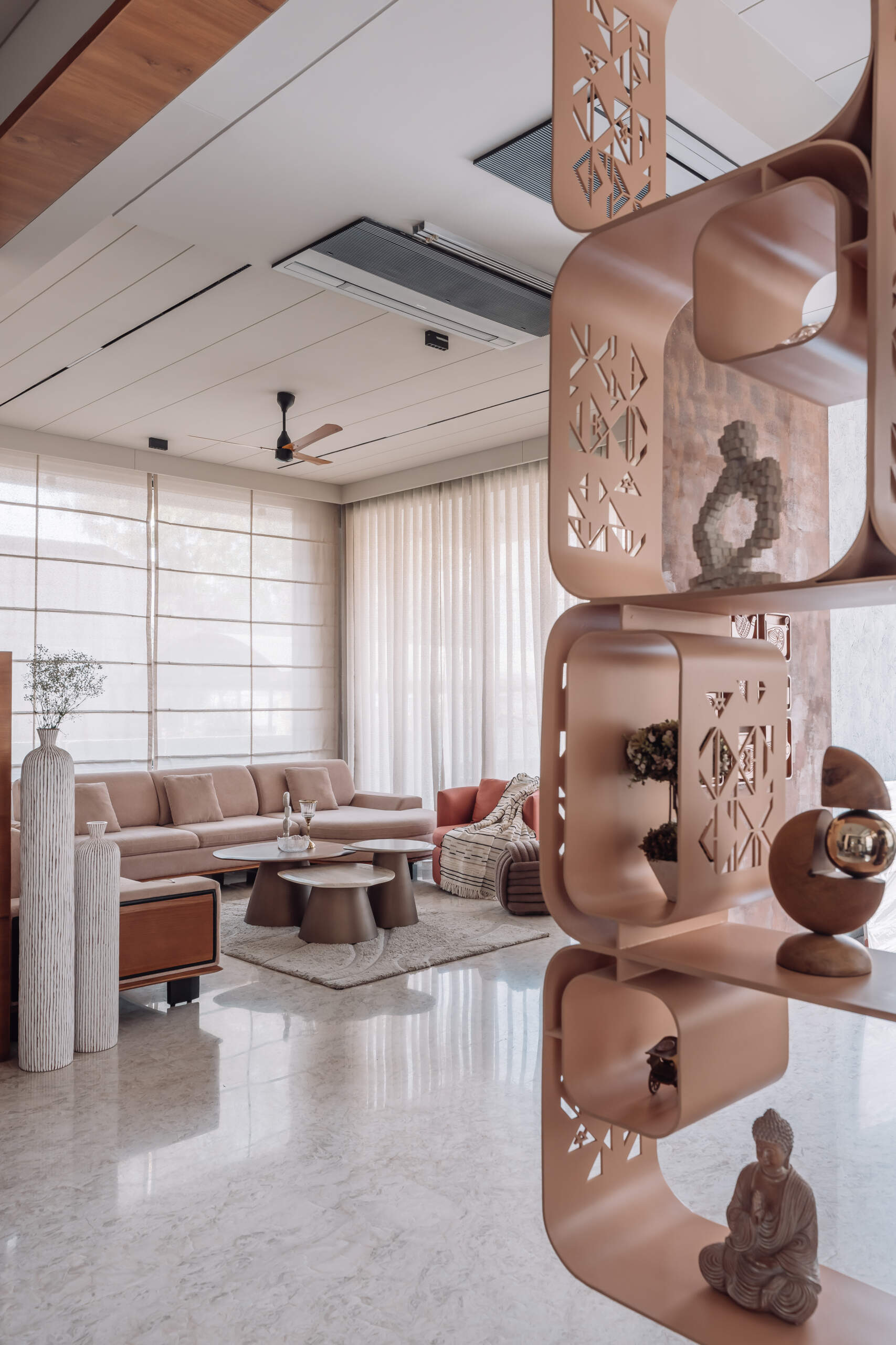 A rotating TV hidden inside a Corian divider makes these two living spaces surprisingly flexible for family life and entertaining.