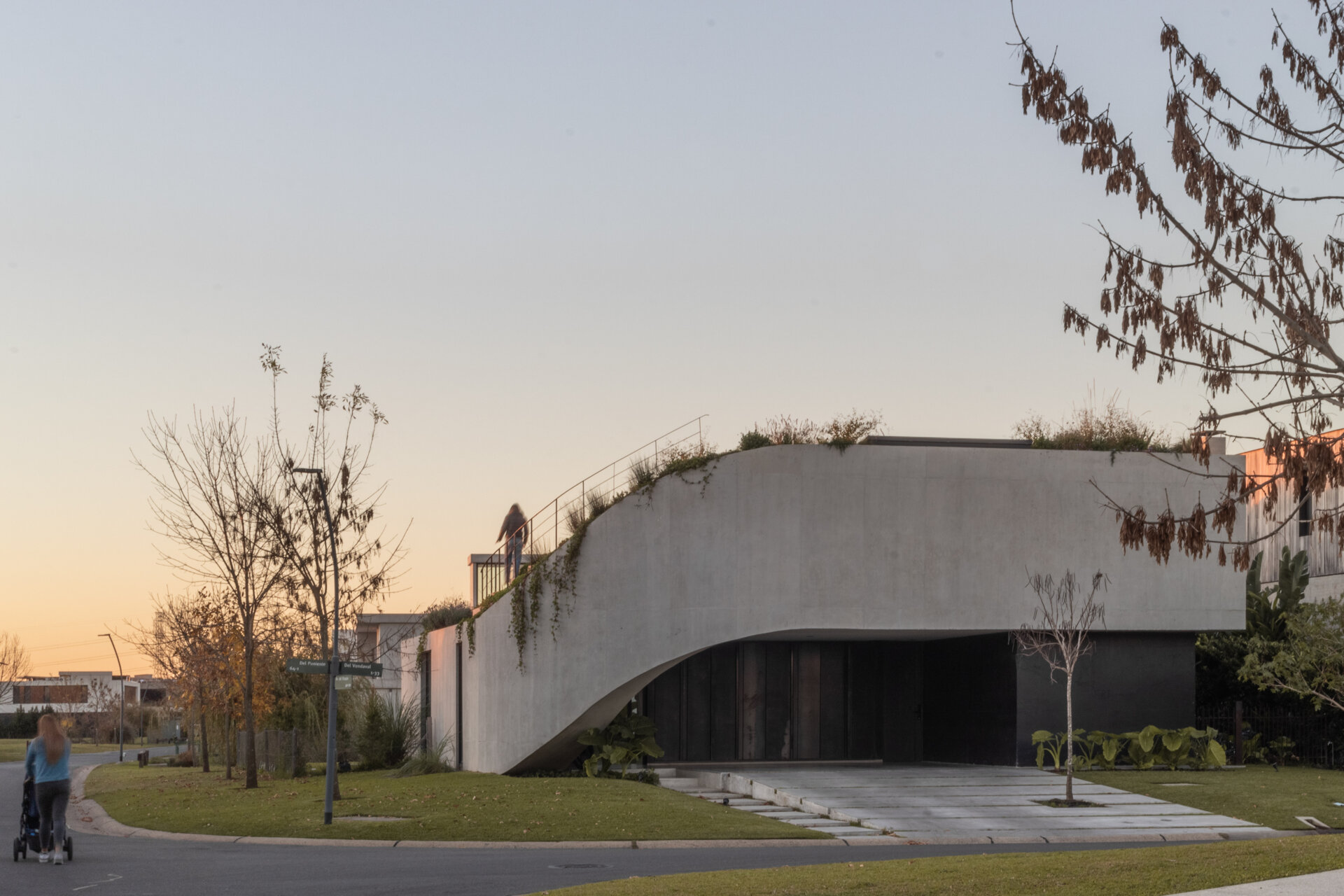 Explore the concrete architecture of GP House, featuring sculptural forms, expansive glazing, and a rooftop garden overlooking the lagoon.