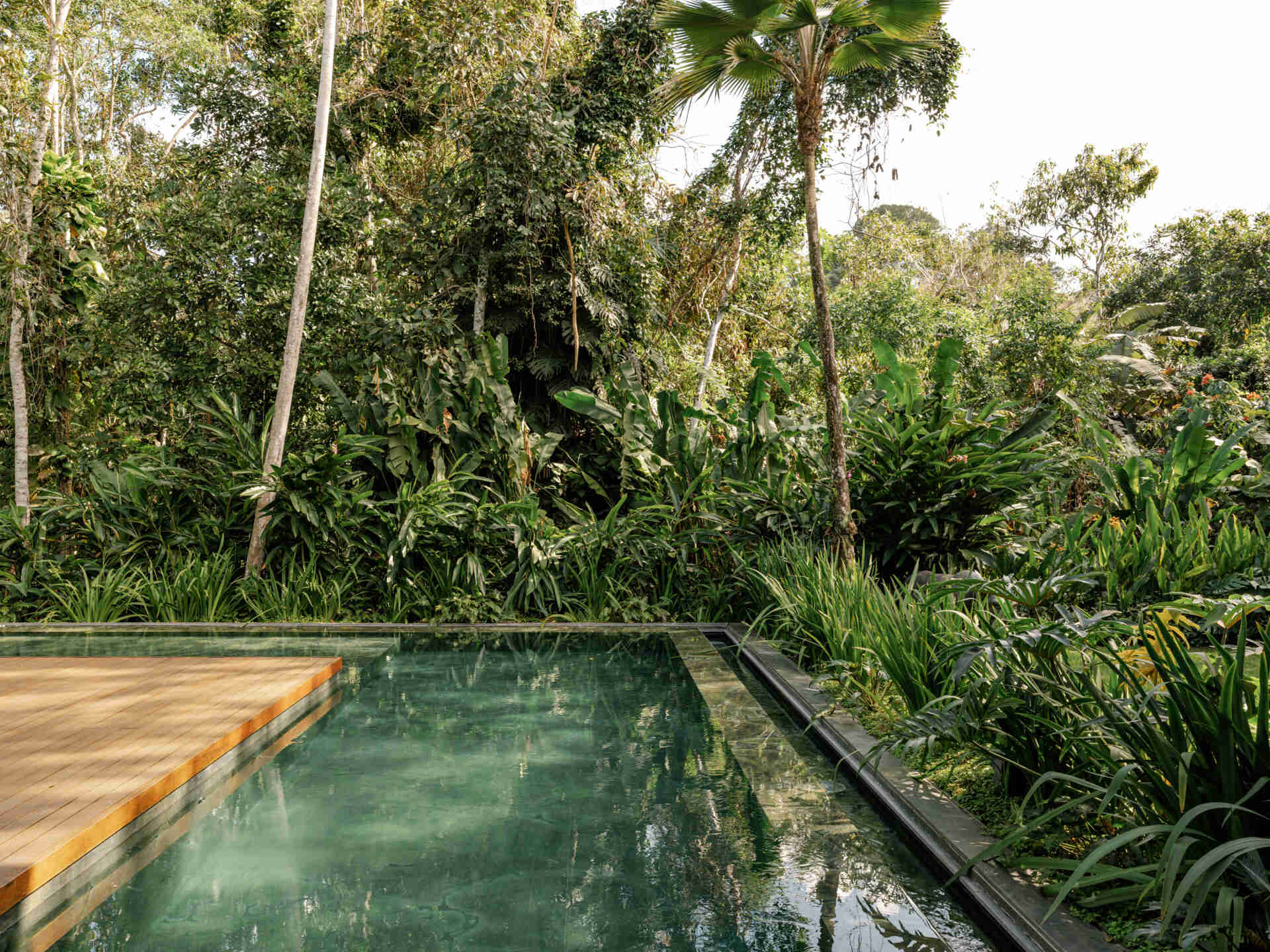 This green marble swimming pool and timber deck create one of the most beautiful outdoor spaces in the home.