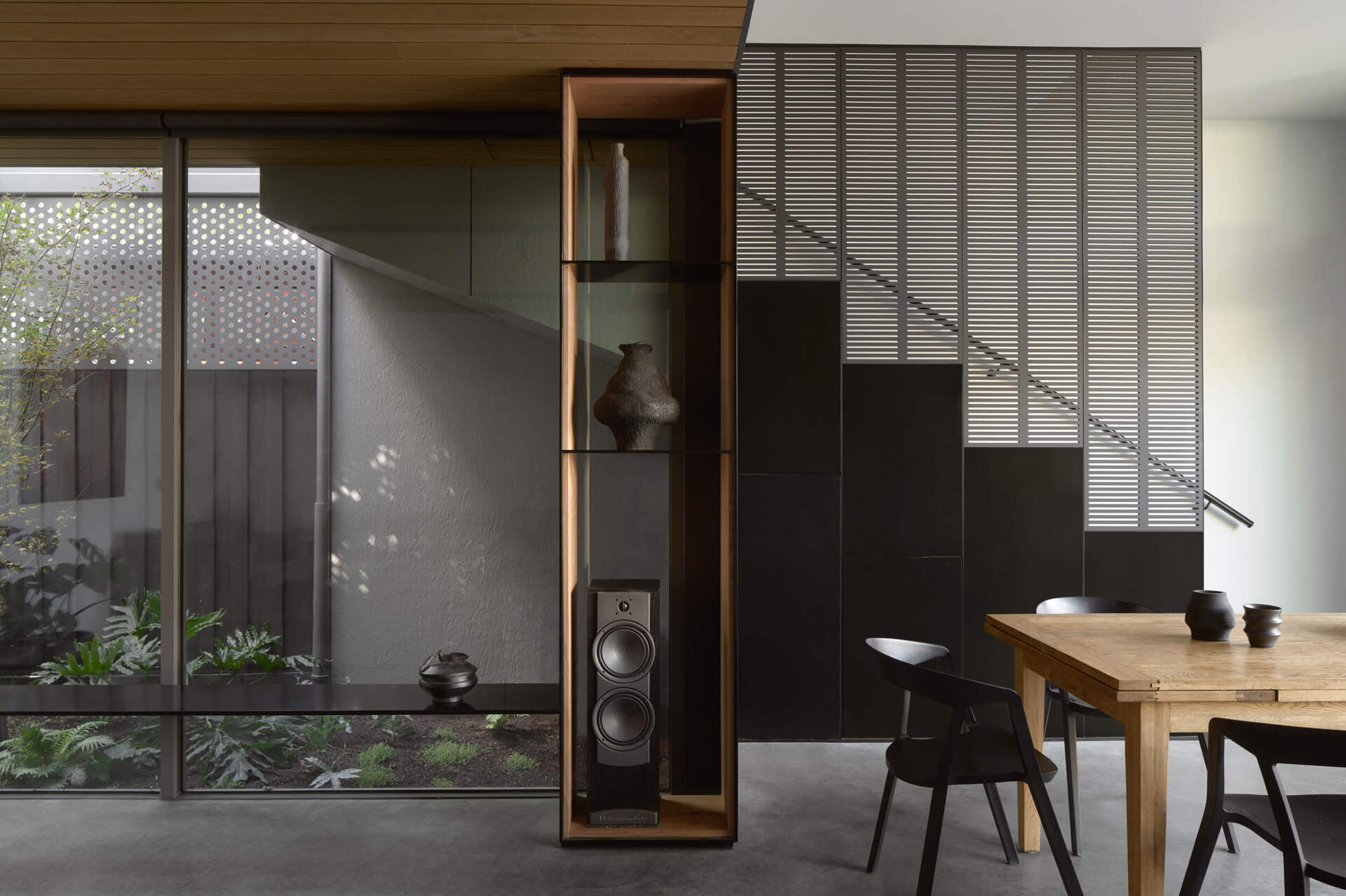 Natural light and a central garden courtyard make this dining space one of the brightest features of the home.