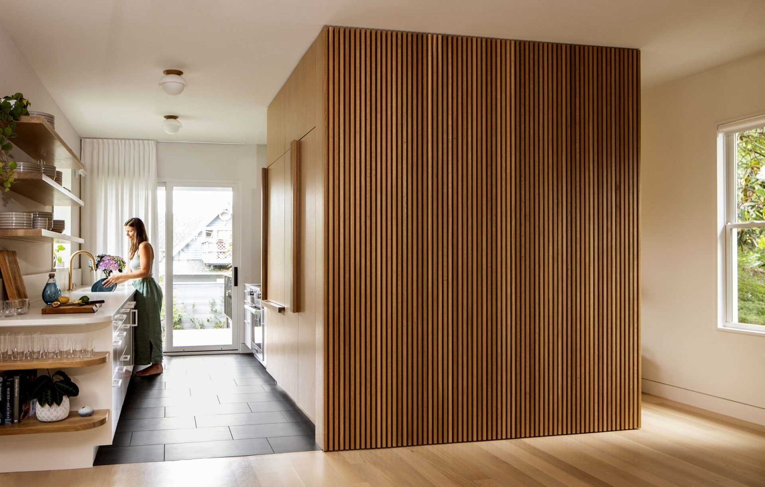 A smaller footprint creates a better kitchen. See how this efficient design improves storage, circulation, and everyday family living.