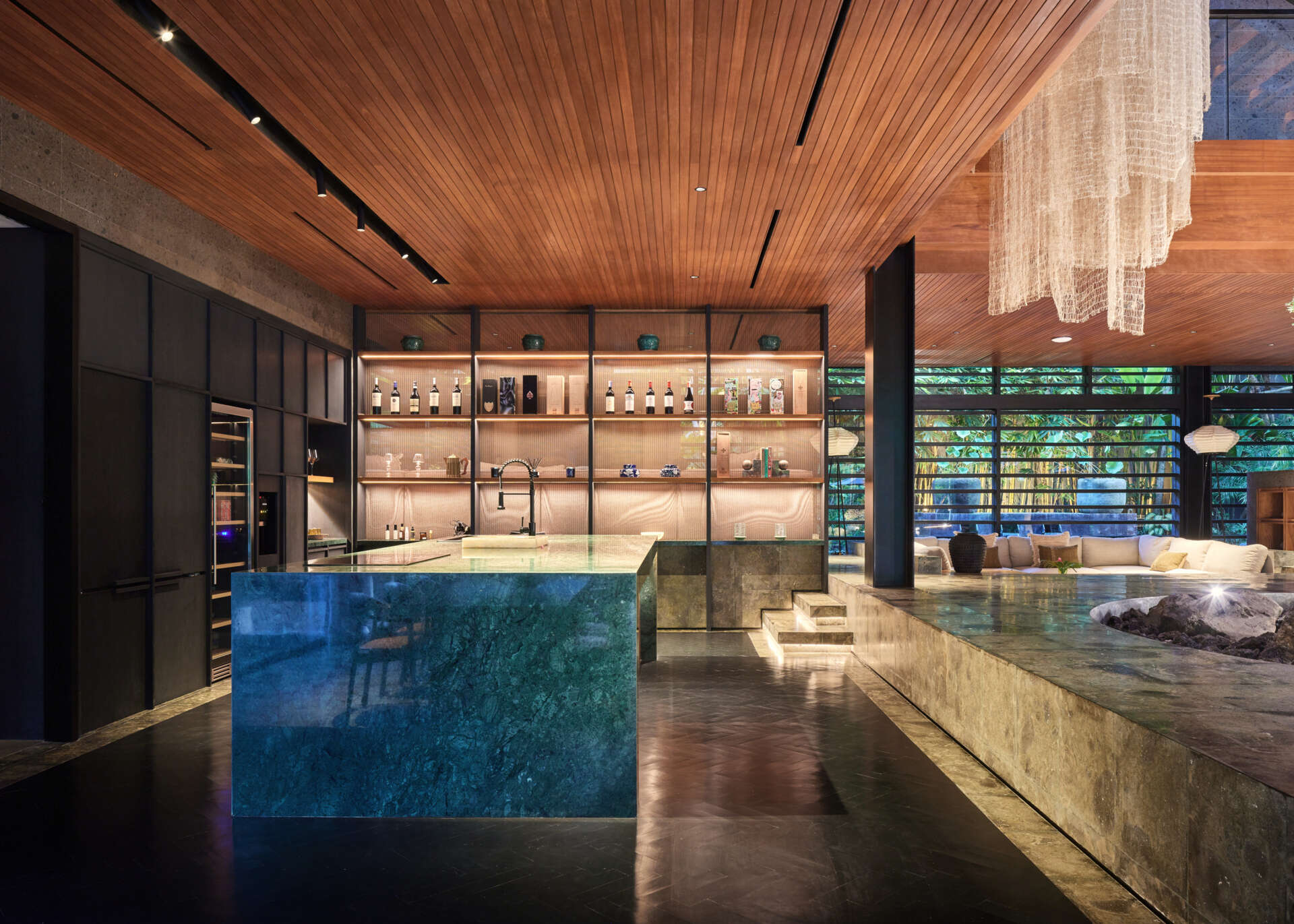 Natural marble, timber and stone give Villa Suki's minimalist kitchen a warm and timeless feel.