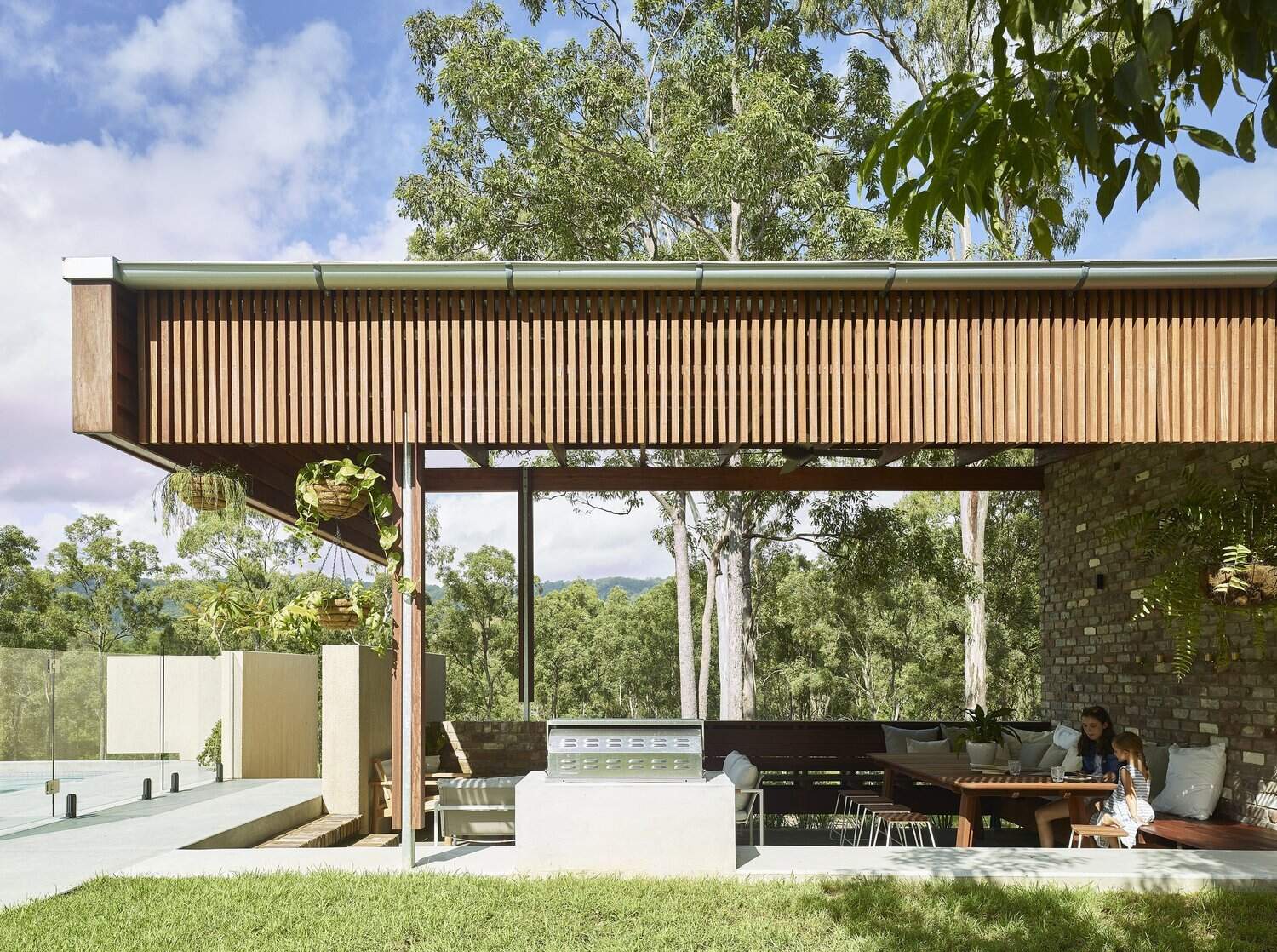 A spacious lawn, outdoor kitchen and swimming pool make this Brisbane acreage home perfect for entertaining.