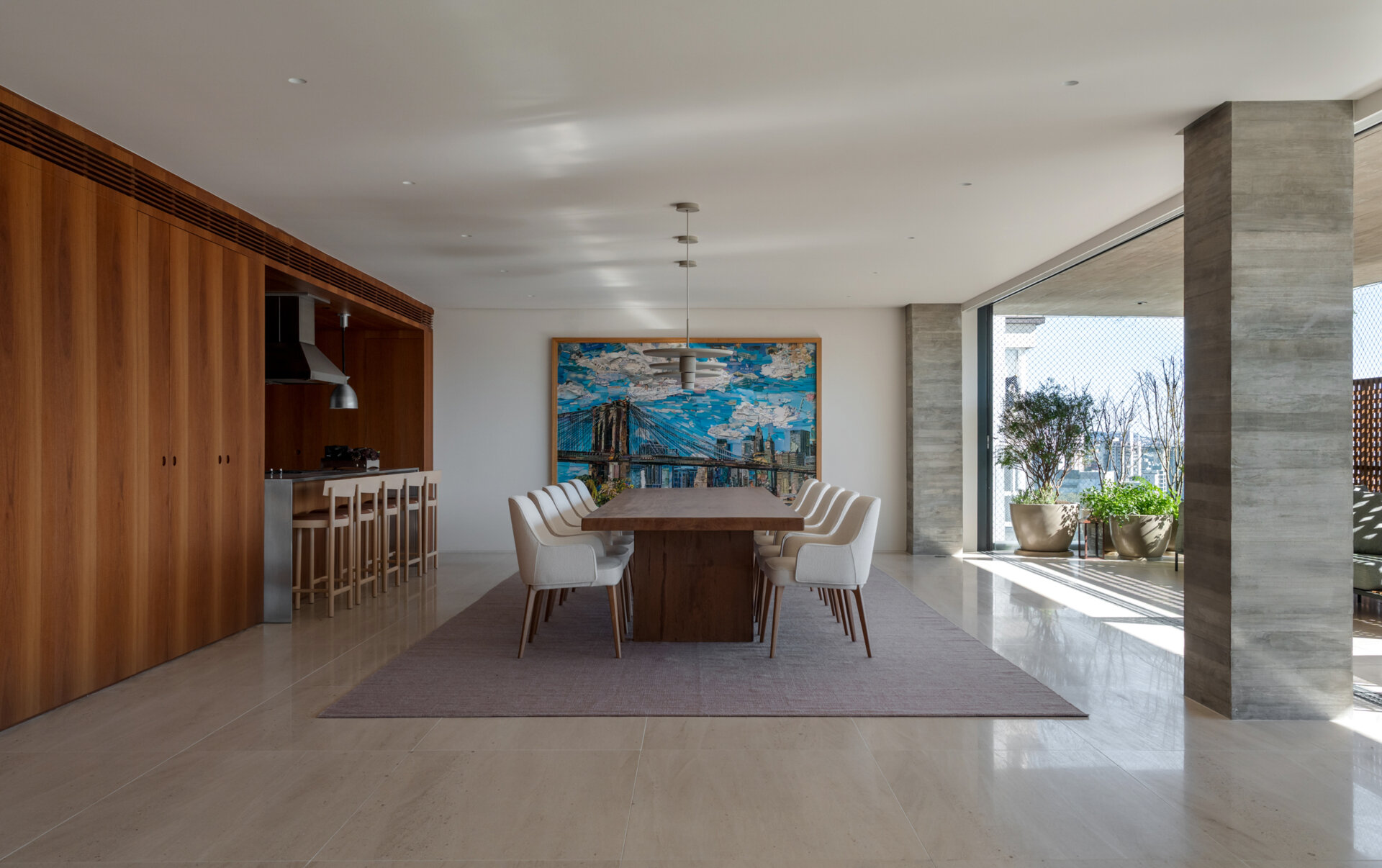 A solid timber dining table, designer lighting and artwork by Vik Muniz make this dining room simple, elegant and welcoming.