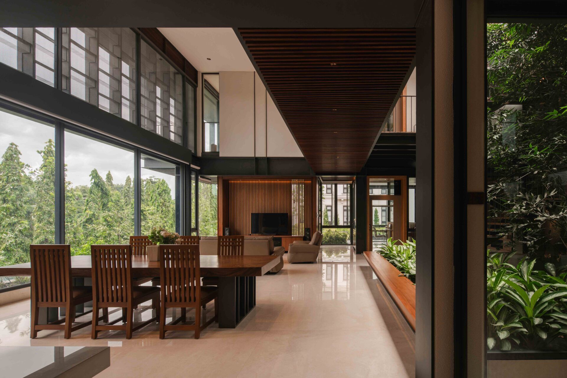 Discover an open-plan living space with park views, exposed steel, warm timber finishes and seamless indoor-outdoor connections.