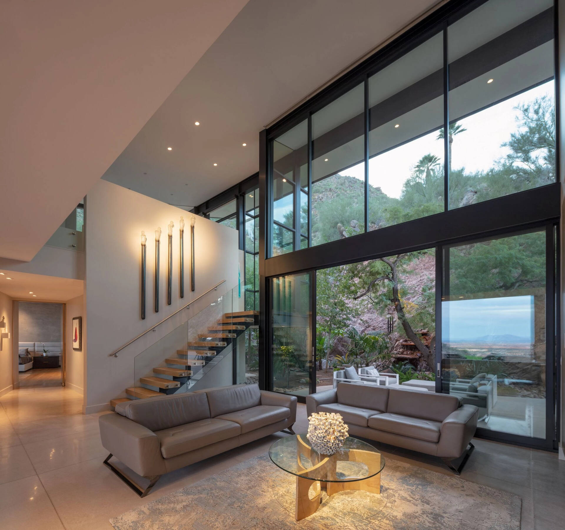 High ceilings, terrazzo concrete floors, and easy access to outdoor patios give these living spaces an airy feel.