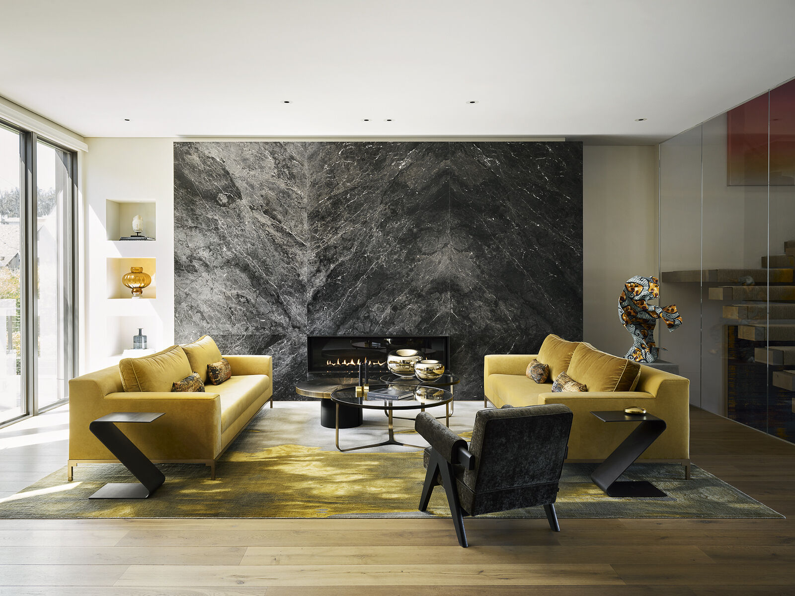 Bold mustard sofas, sculptural furnishings, and contemporary artwork bring energy and personality to this inviting living room. Discover how rich color, layered textures, and carefully chosen statement pieces create a space that's both expressive and effortlessly comfortable.