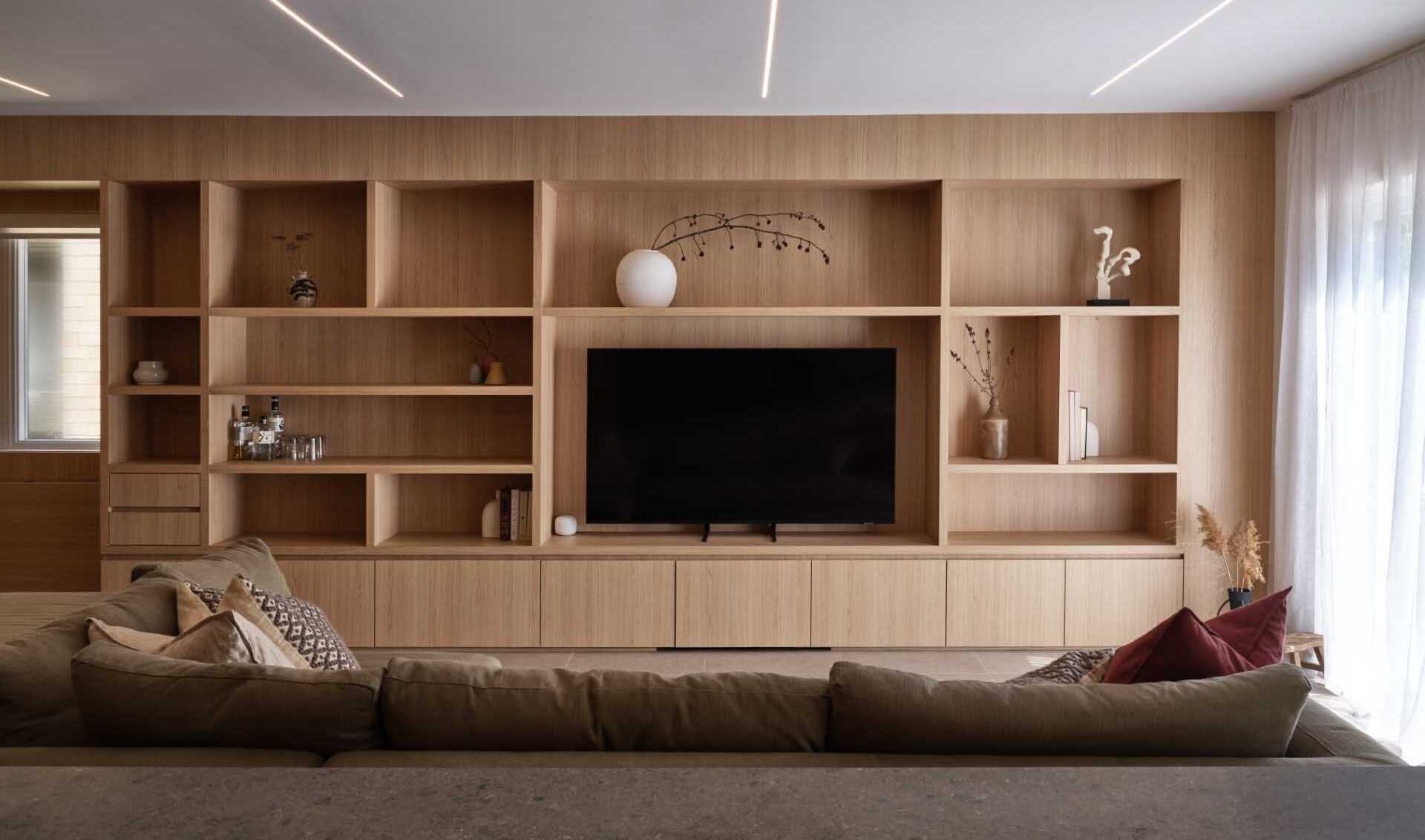 Discover how Atelier SUN transformed a challenging 1980s builder home by turning bulky columns and beams into elegant architectural features that enhance the entire interior.