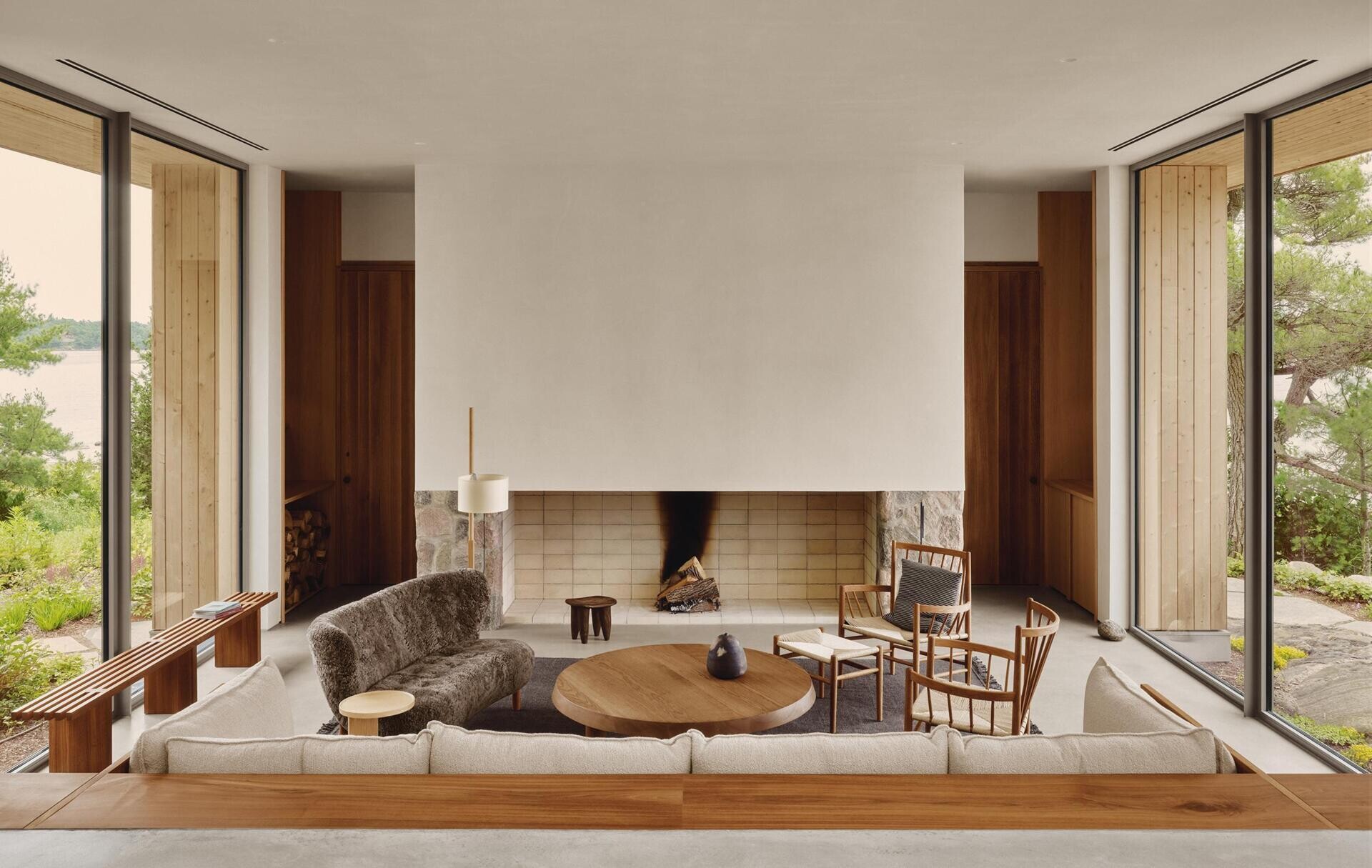 This inviting living room combines a dramatic fireplace, walnut furniture and handcrafted details for a timeless cottage interior.