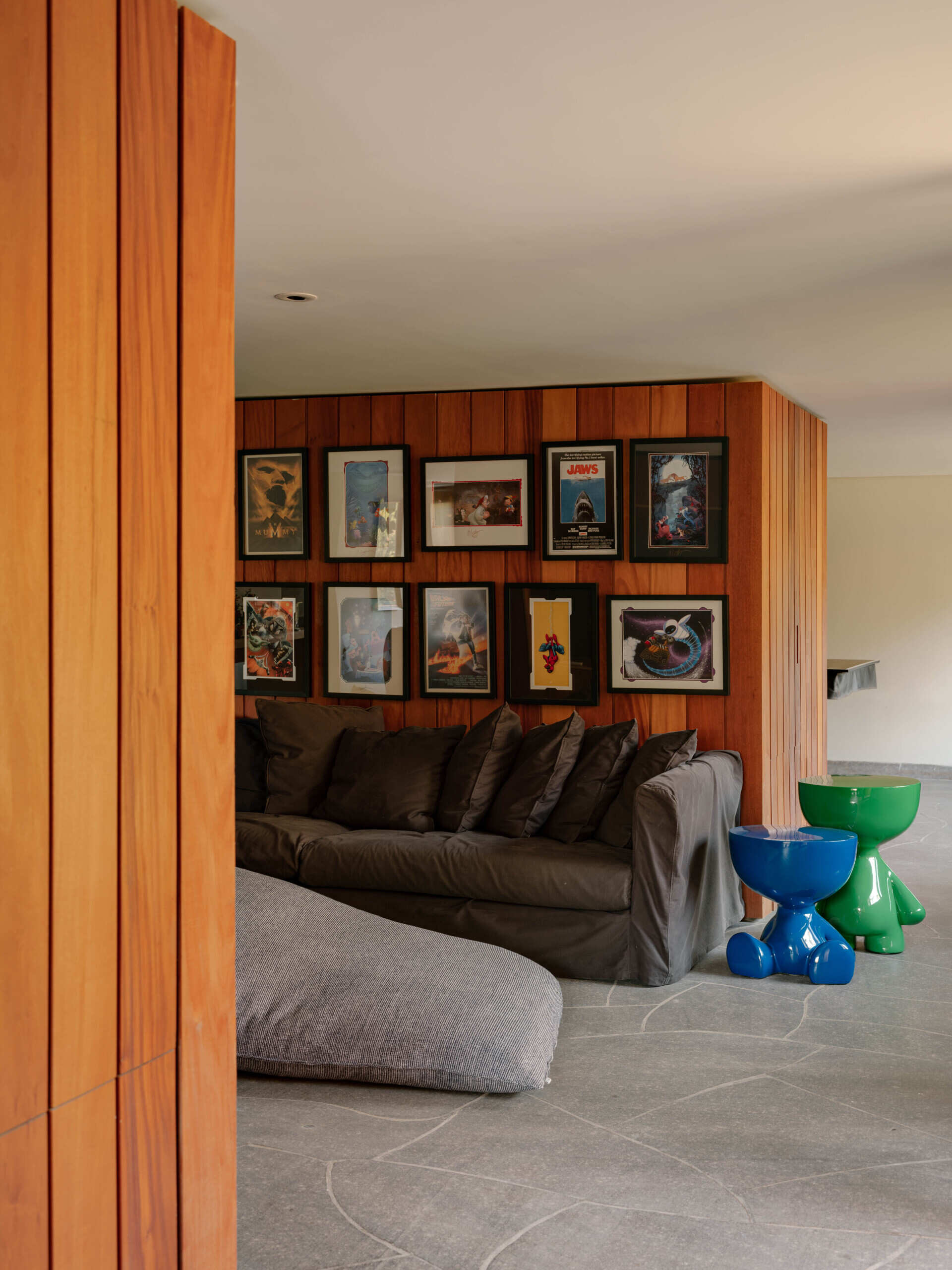 The hall functions as both a gallery and an important link between different areas of the house, leading naturally into the family lounge and nearby living spaces.