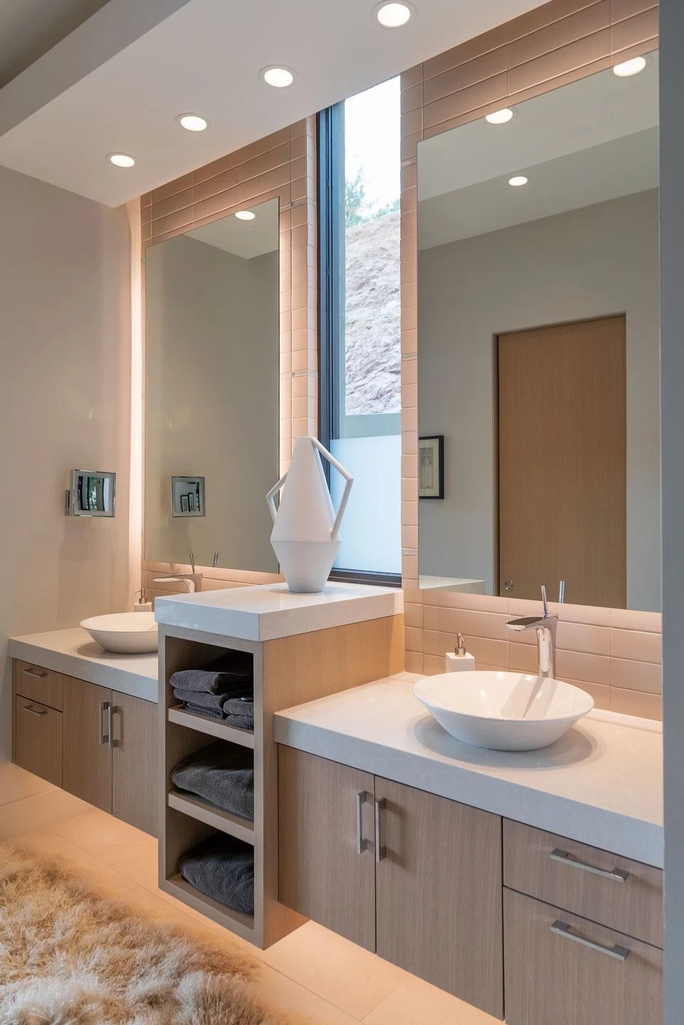 loor-to-ceiling tiles, dual vanities, and a private garden patio make this bathroom stand out.