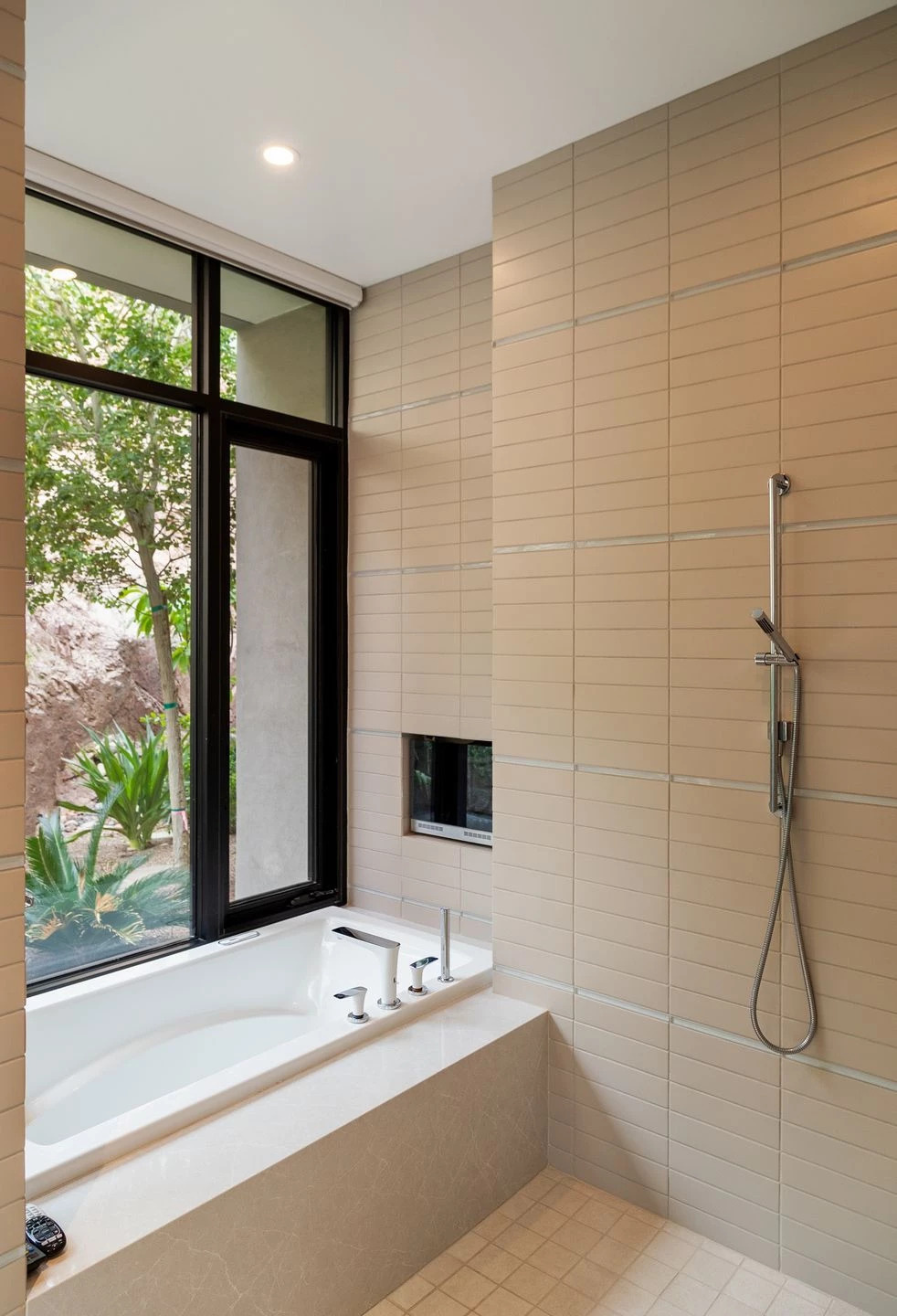 loor-to-ceiling tiles, dual vanities, and a private garden patio make this bathroom stand out.