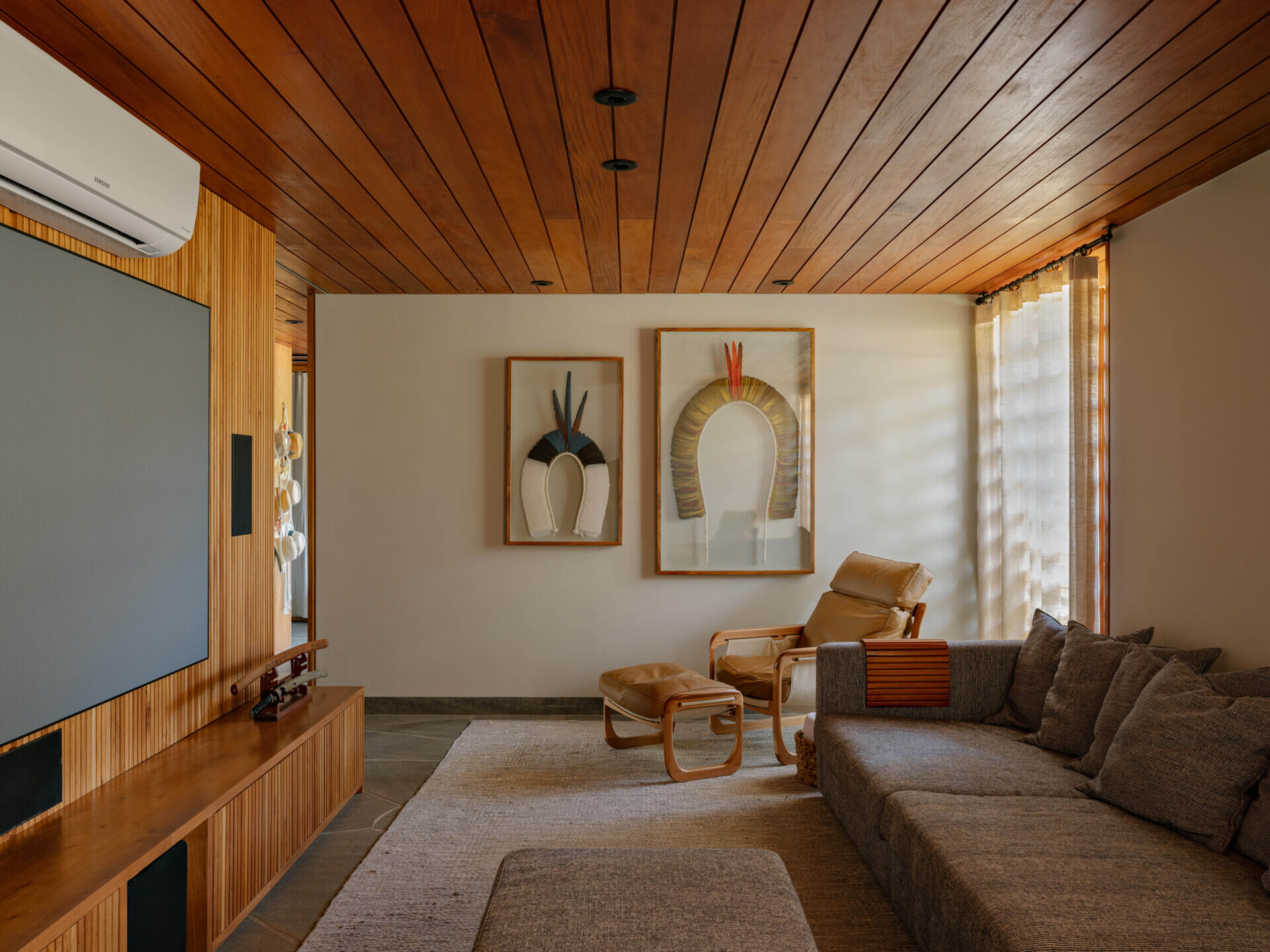 Away from the larger entertaining spaces, the lower level houses a dedicated media and games room. Positioned separately from the home's main social areas, it provides a more private place for movie nights, games and spending time together without interrupting activity elsewhere in the house.