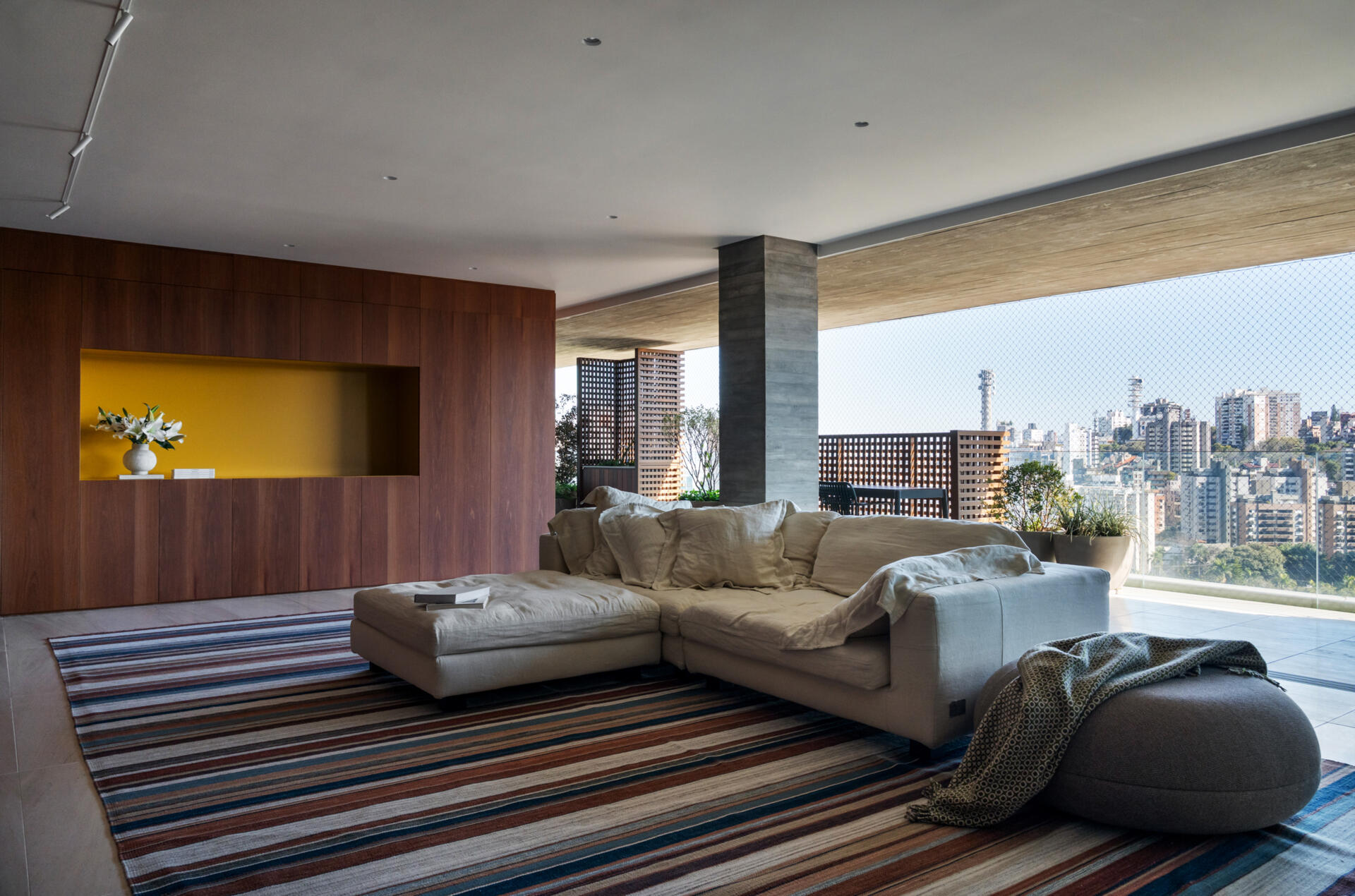 This media room combines a library, TV lounge and children's play area with beautifully integrated custom shelving.
