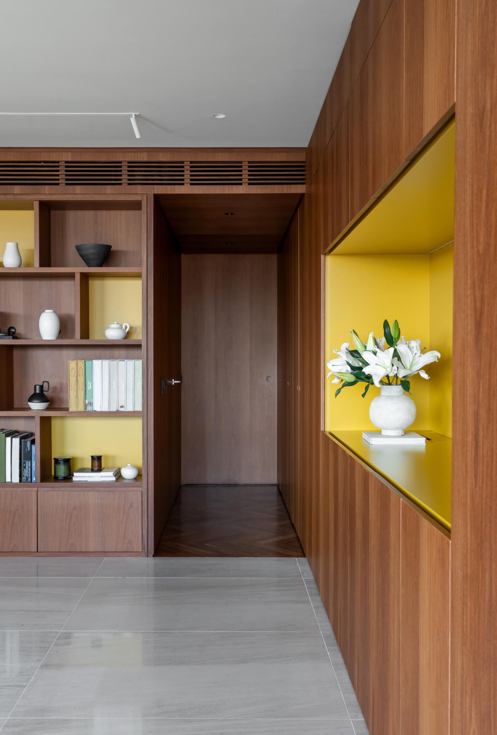 This media room combines a library, TV lounge and children's play area with beautifully integrated custom shelving.