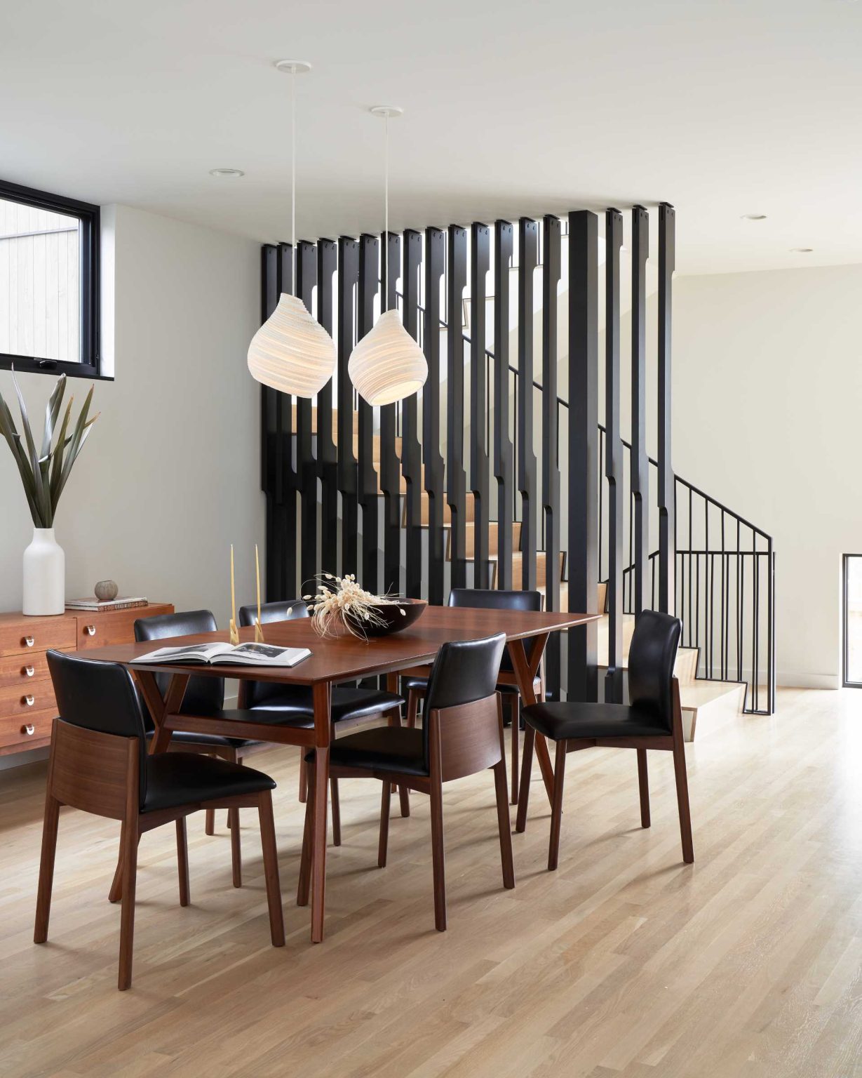 Removing walls created one spacious living, dining, and kitchen area that feels brighter, more open, and better suited to family living.