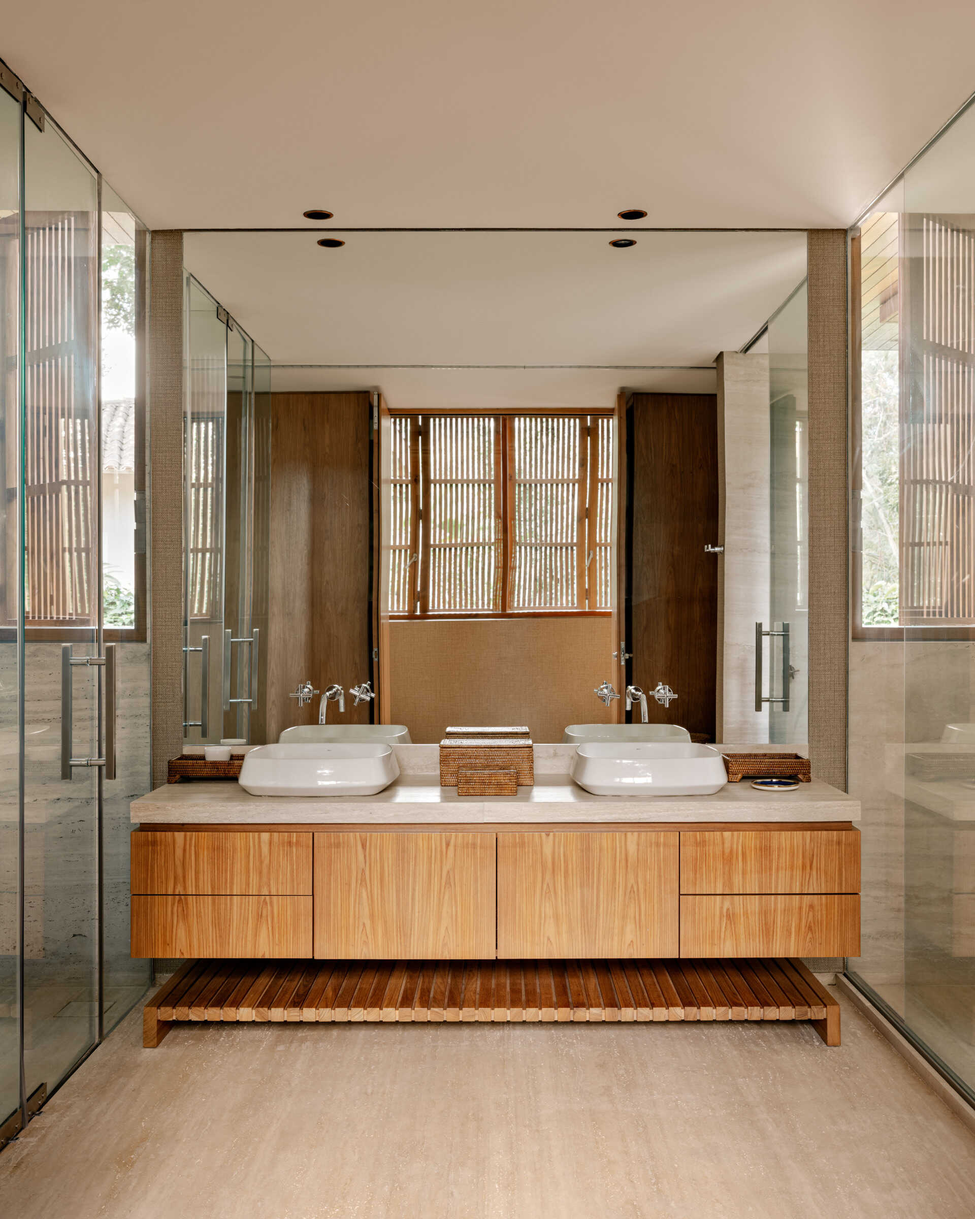 Natural stone and warm timber details give this primary bathroom a timeless feel.