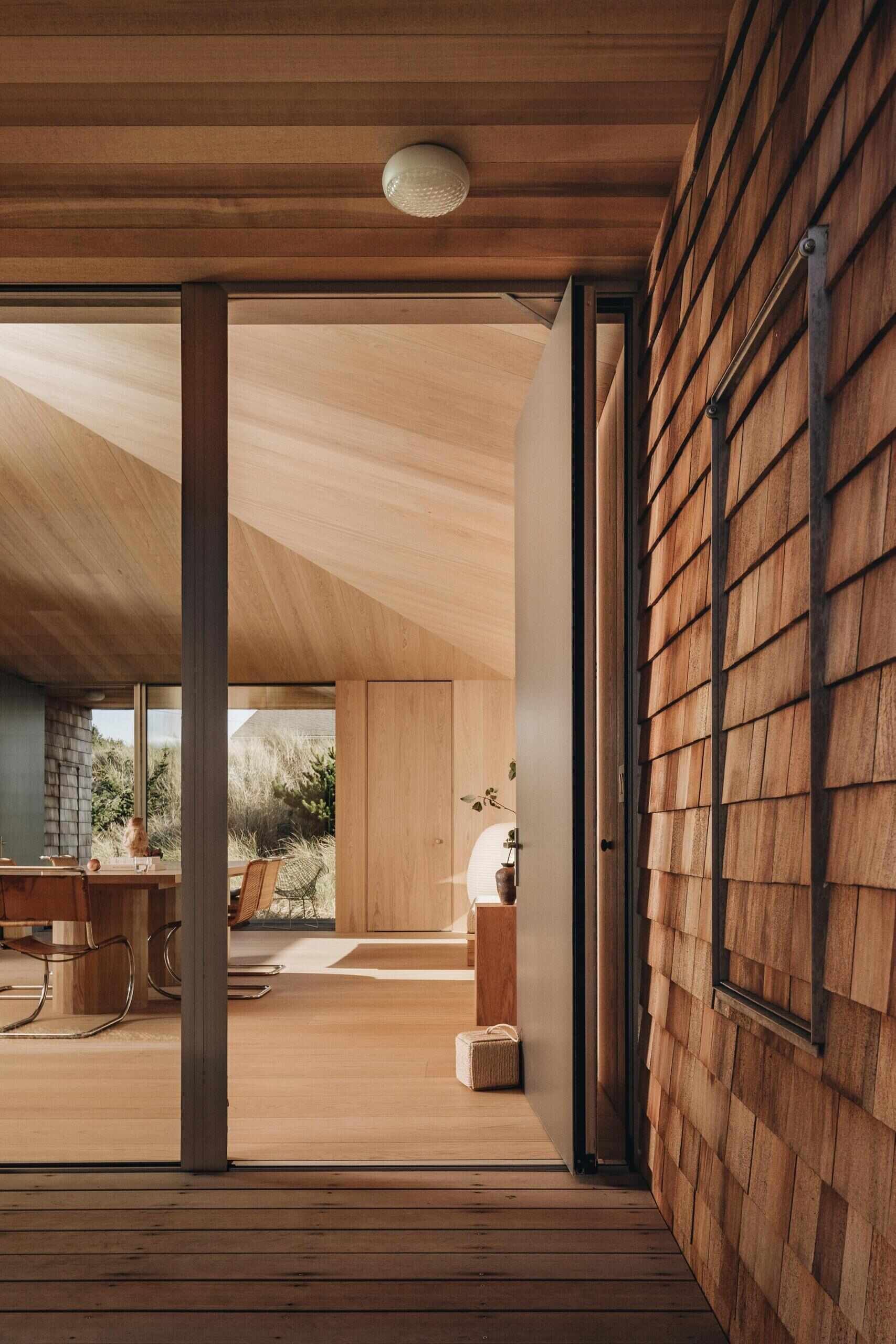 Dune House by Waechter Architecture pairs weathered cedar with warm oak interiors on the North Oregon Coast. See how simple materials, panoramic windows, and minimalist design create a timeless beach home.