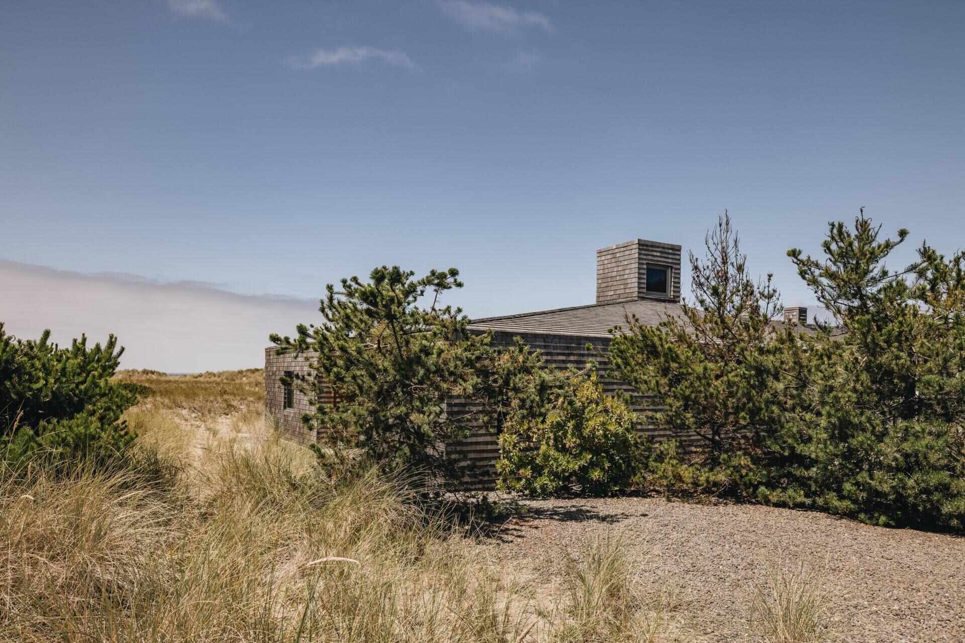 Dune House by Waechter Architecture pairs weathered cedar with warm oak interiors on the North Oregon Coast. See how simple materials, panoramic windows, and minimalist design create a timeless beach home.