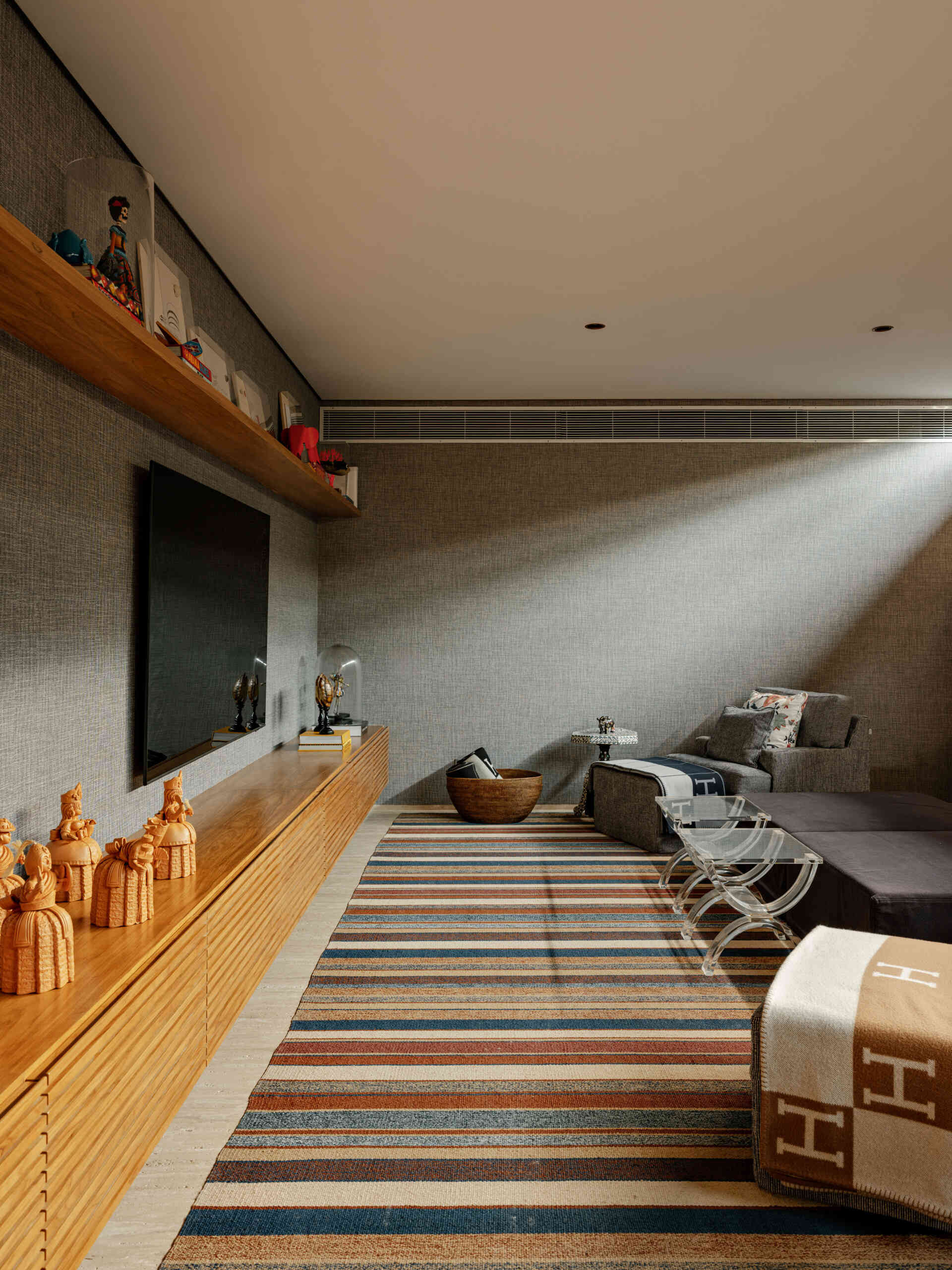 Every great beach house needs a cosy media room, and this one offers the perfect escape.
