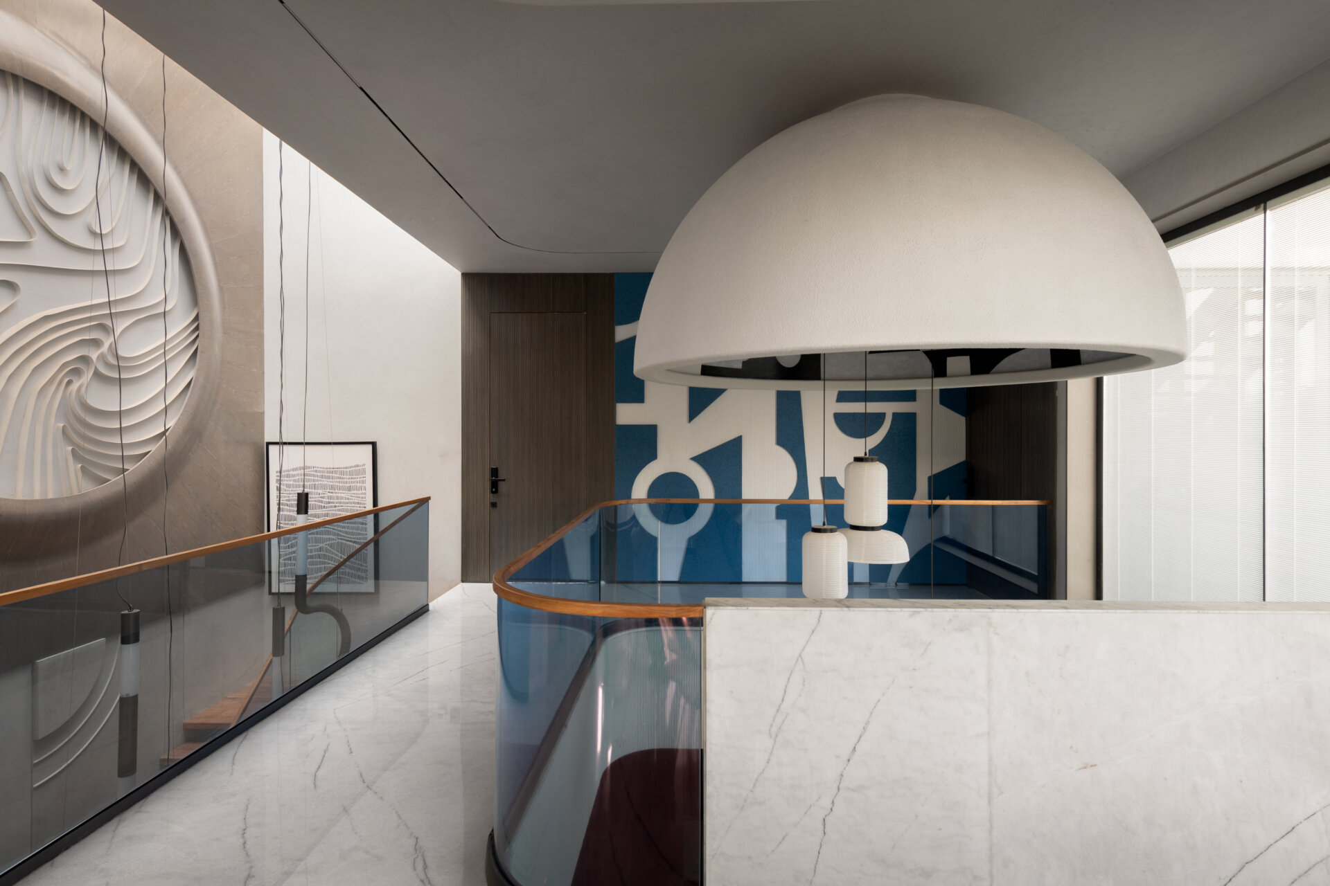 Gallery-inspired hallways filled with artwork, dramatic views and curved architecture make every transition memorable.