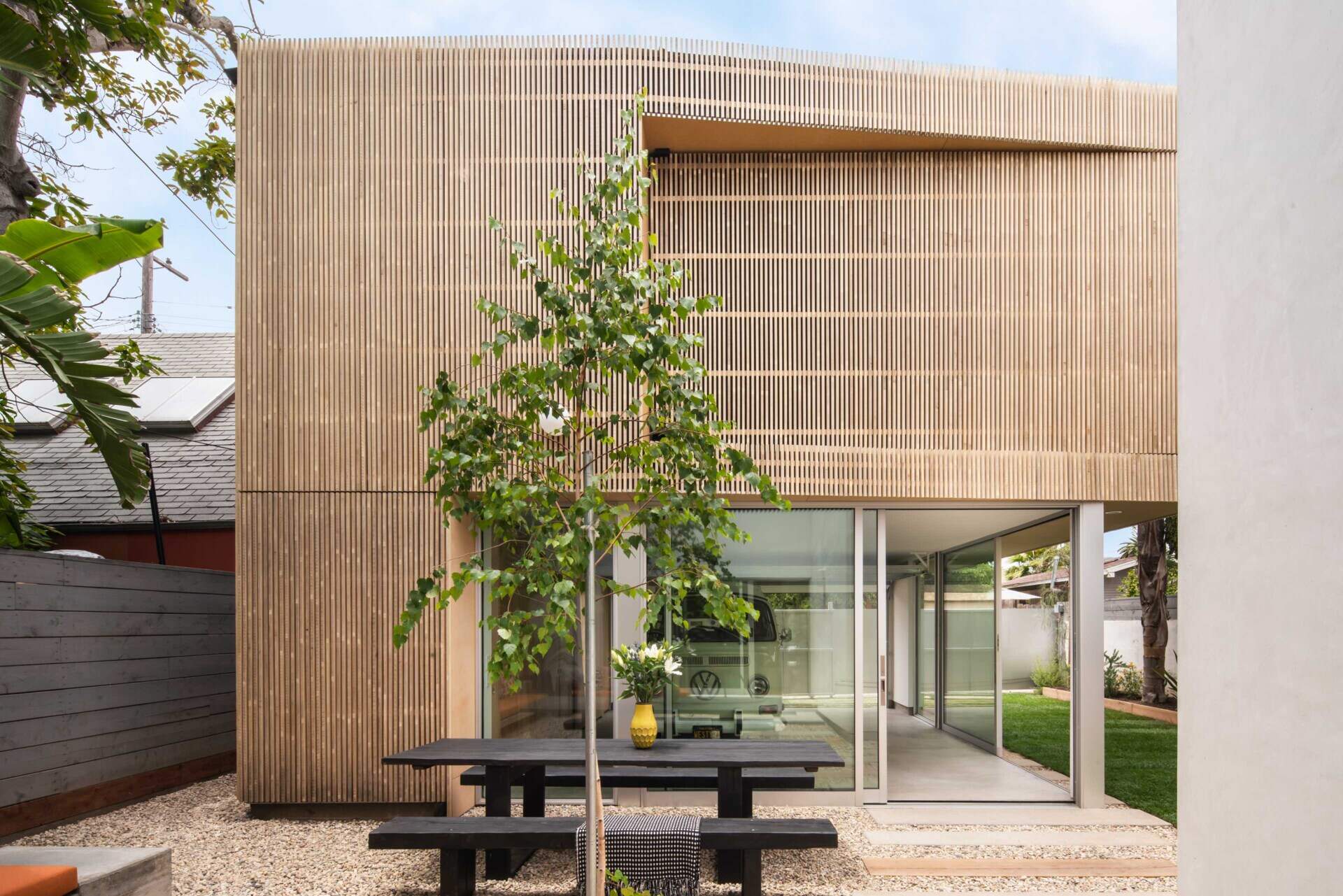 See how a rebuilt garage helped create a beautiful courtyard, more garden space, and a modern backyard layout for this California family home.