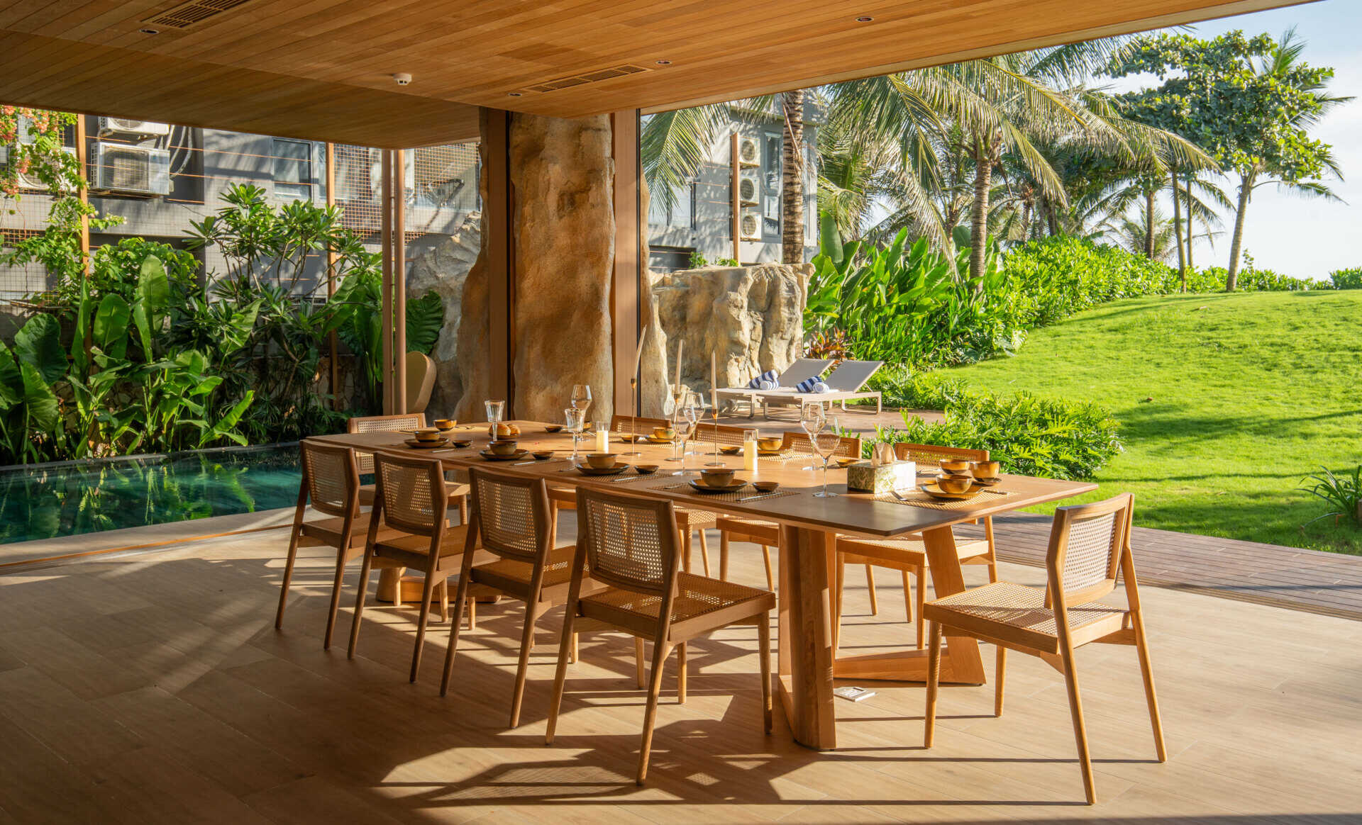 A light-filled dining area sits within the villa's open-plan layout, creating an inviting place for family meals and entertaining.