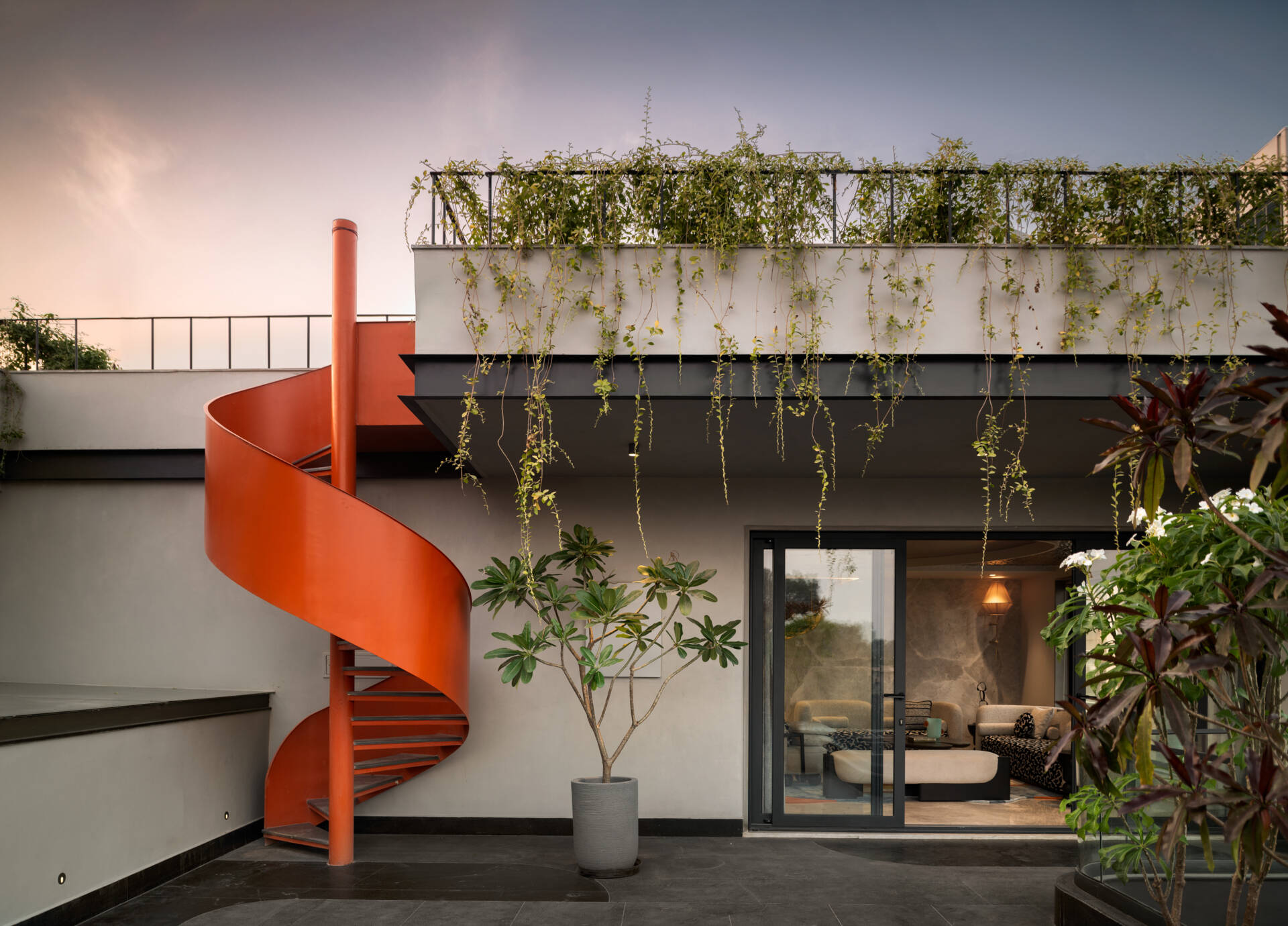 Landscaped rooftop terraces and a vibrant orange spiral staircase add another memorable layer to The Arthouse.