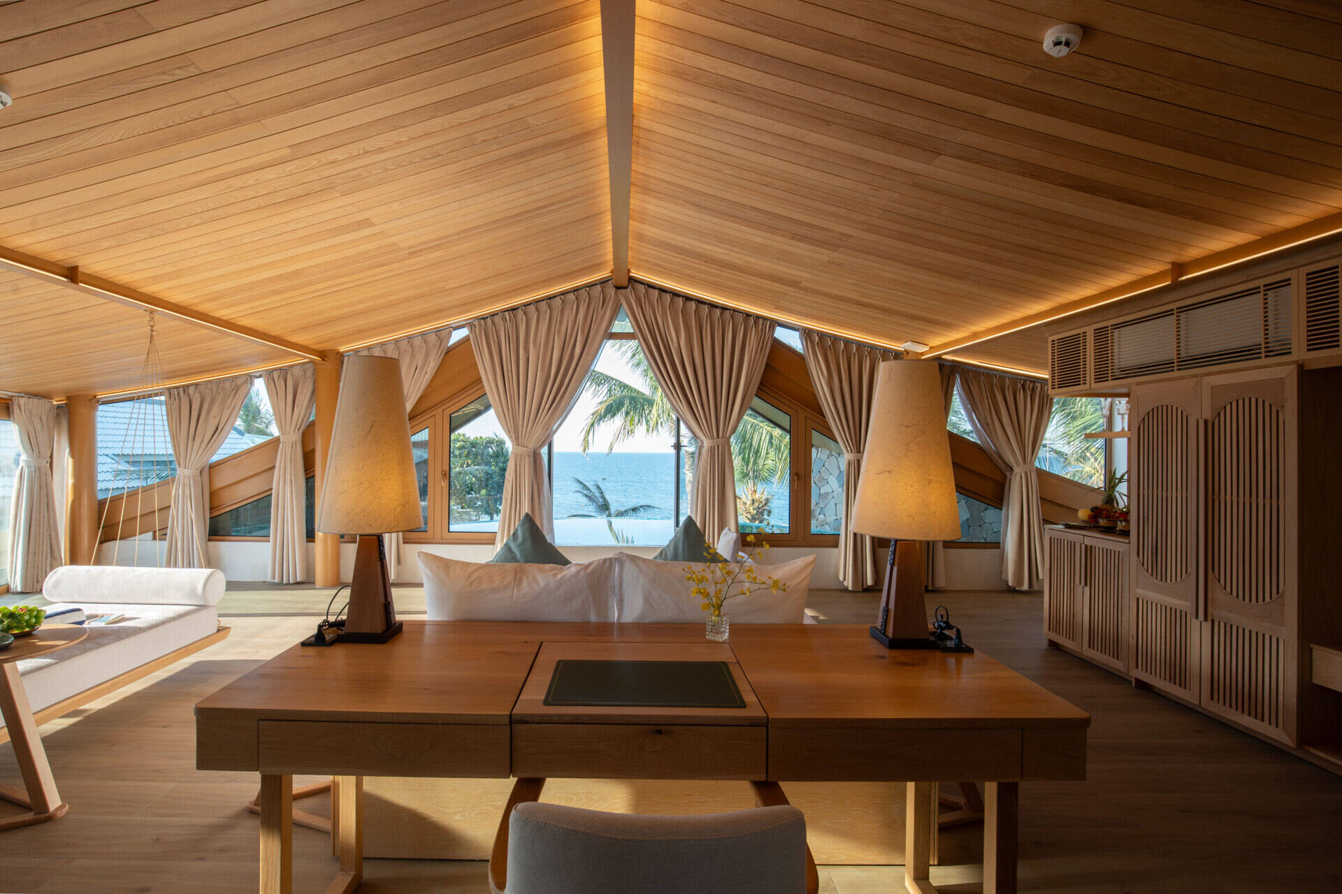 Perched beneath the soaring roof, the primary suite pairs panoramic sea views with its own infinity pool for an unforgettable coastal experience.