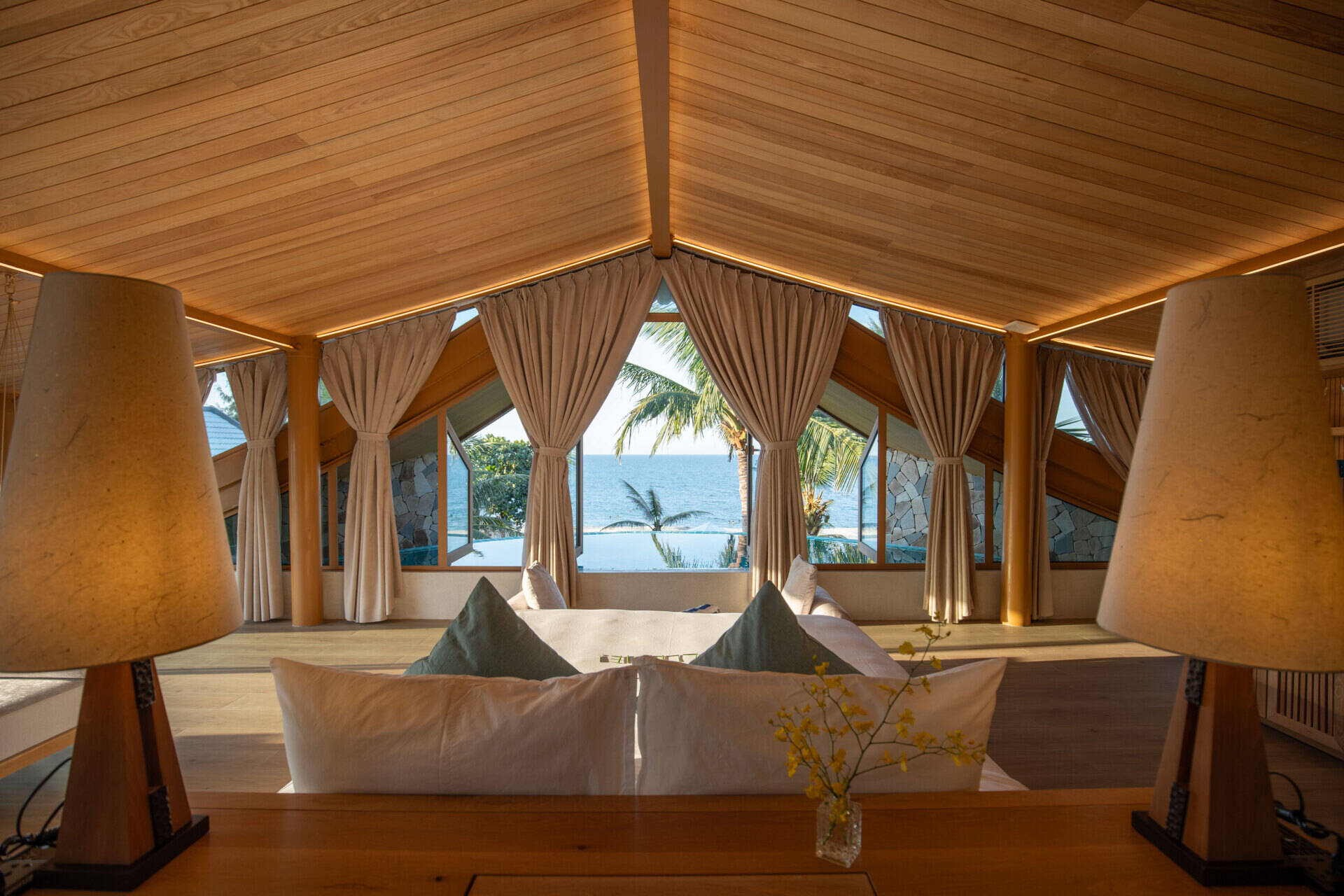 Perched beneath the soaring roof, the primary suite pairs panoramic sea views with its own infinity pool for an unforgettable coastal experience.
