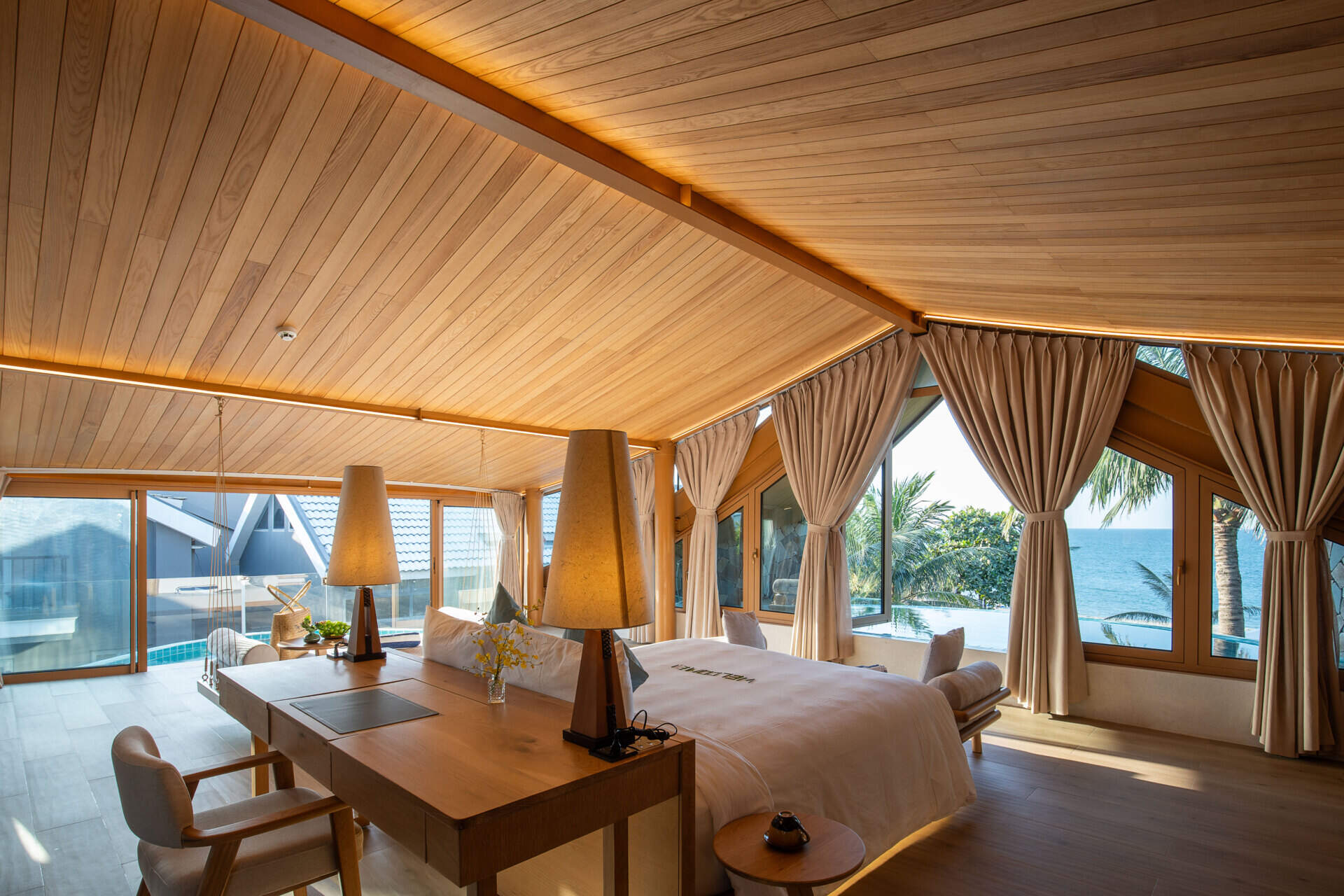Perched beneath the soaring roof, the primary suite pairs panoramic sea views with its own infinity pool for an unforgettable coastal experience.