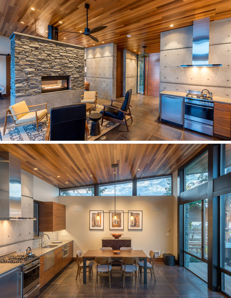 Take a tour of this one-room waterfront studio on Camano Island, where an open floor plan and a double-sided stone fireplace create a clever, space-saving layout.