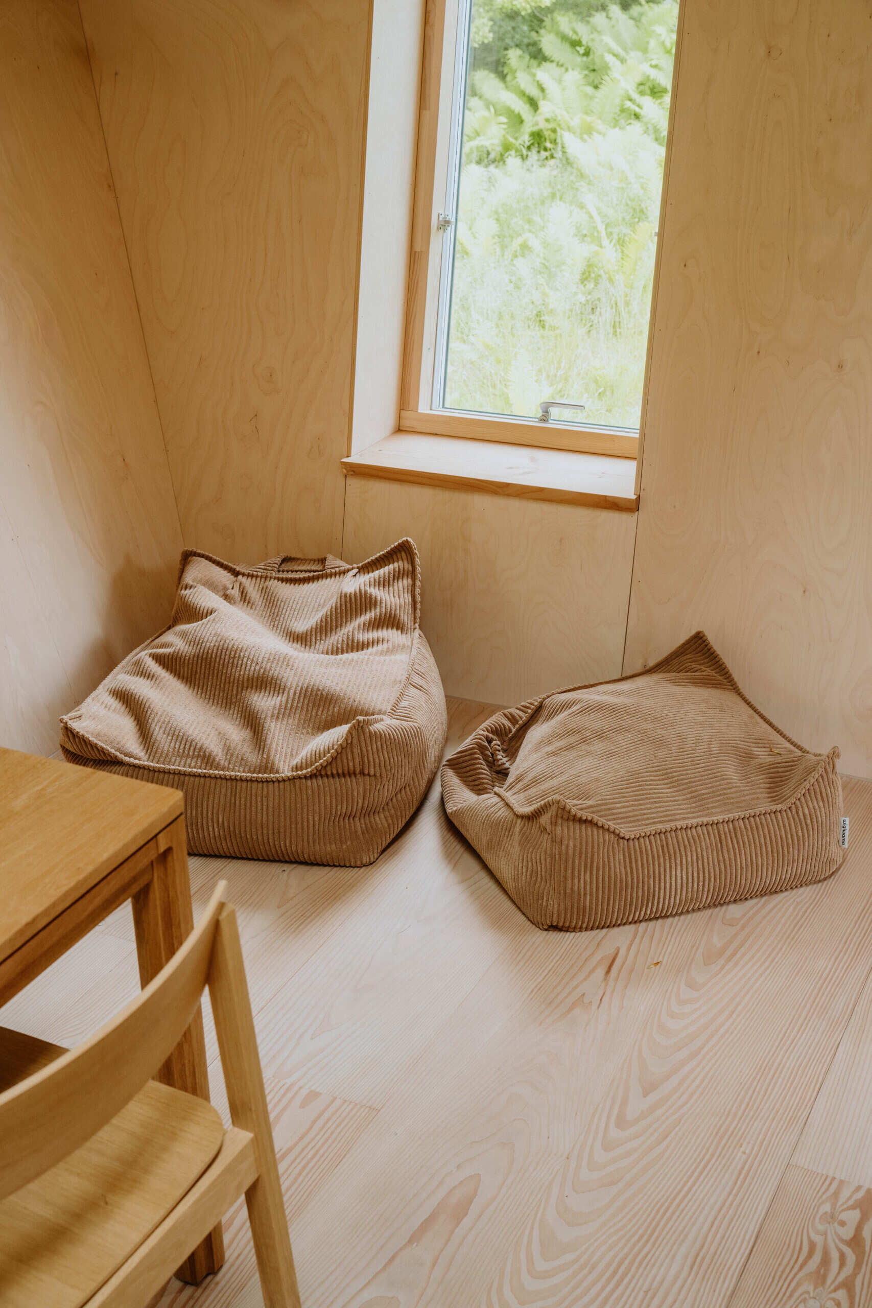 A compact living room that comfortably seats ten people proves small homes can still be highly social.