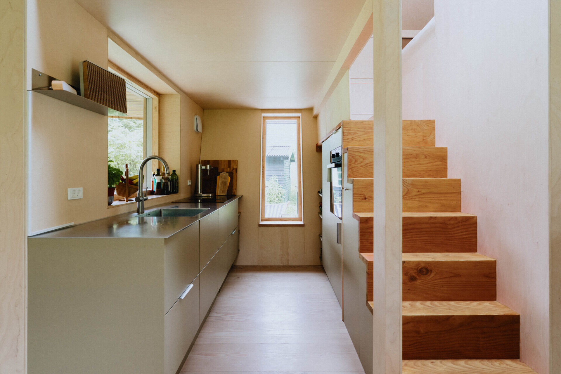 Integrated storage transforms EcoNeo's staircase into one of the hardest-working features in the house.