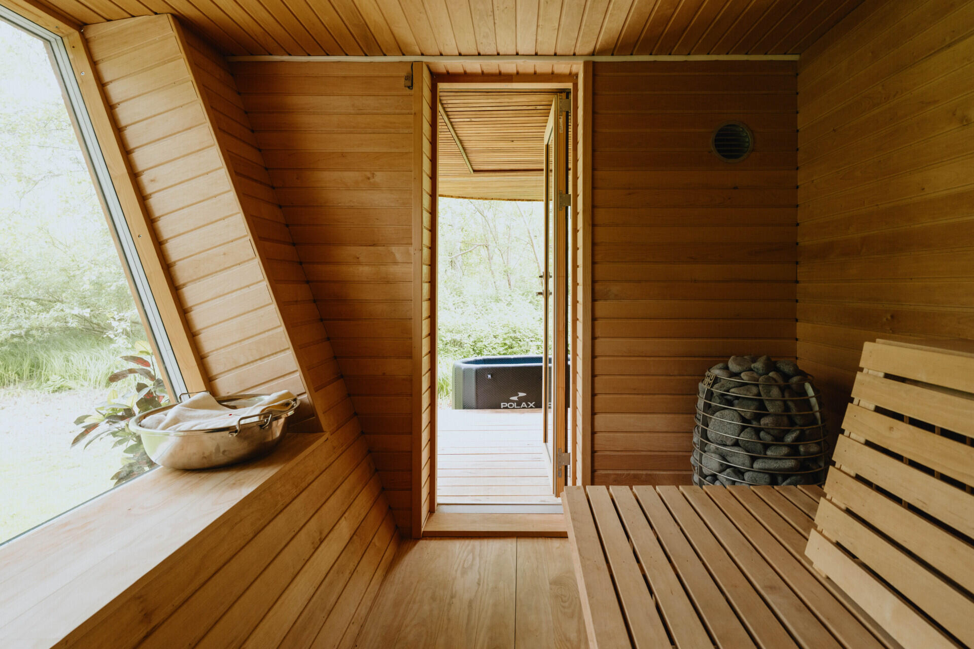 One of EcoNeo's standout features is an indoor sauna that seats eight and converts into extra sleeping space.
