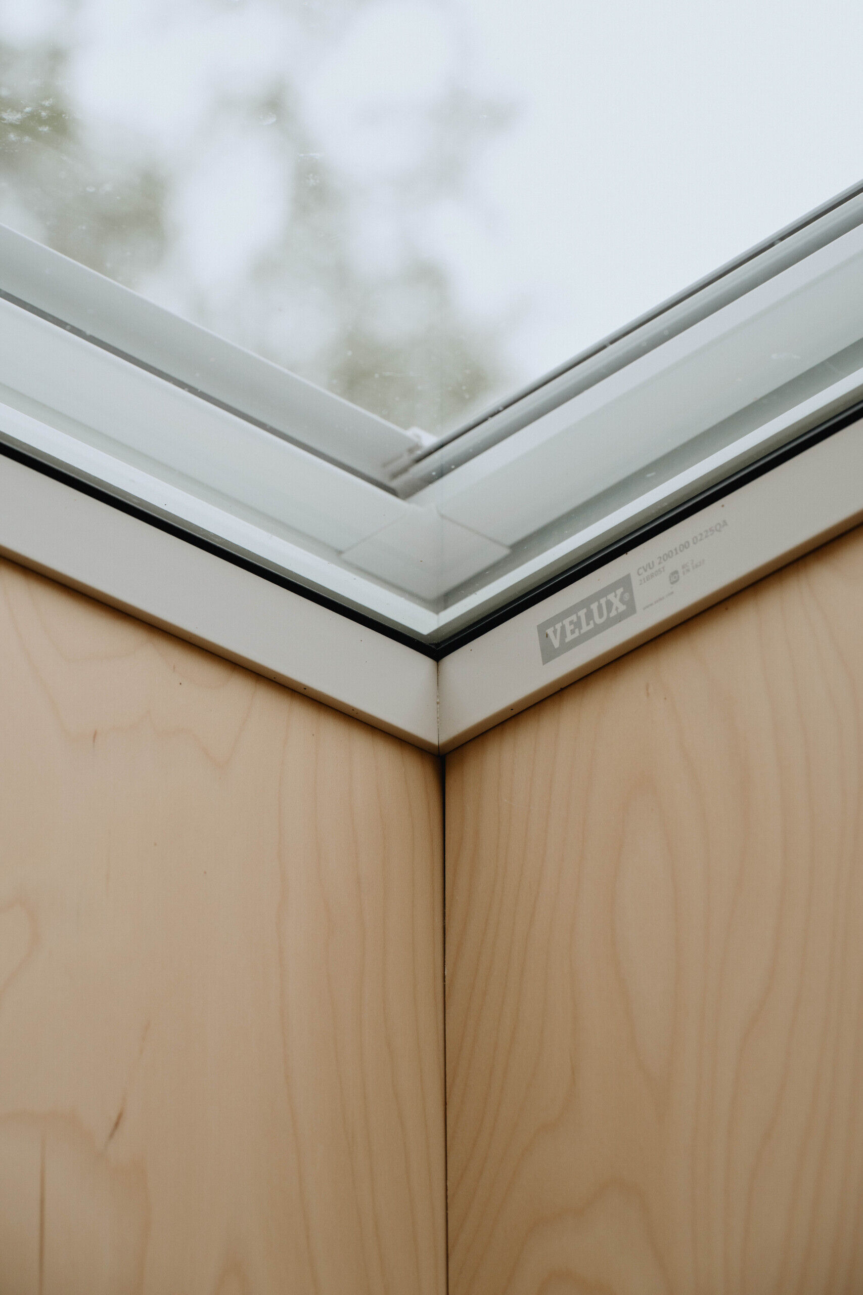 A central skylight fills the compact interior with natural light, making the home feel larger and brighter.