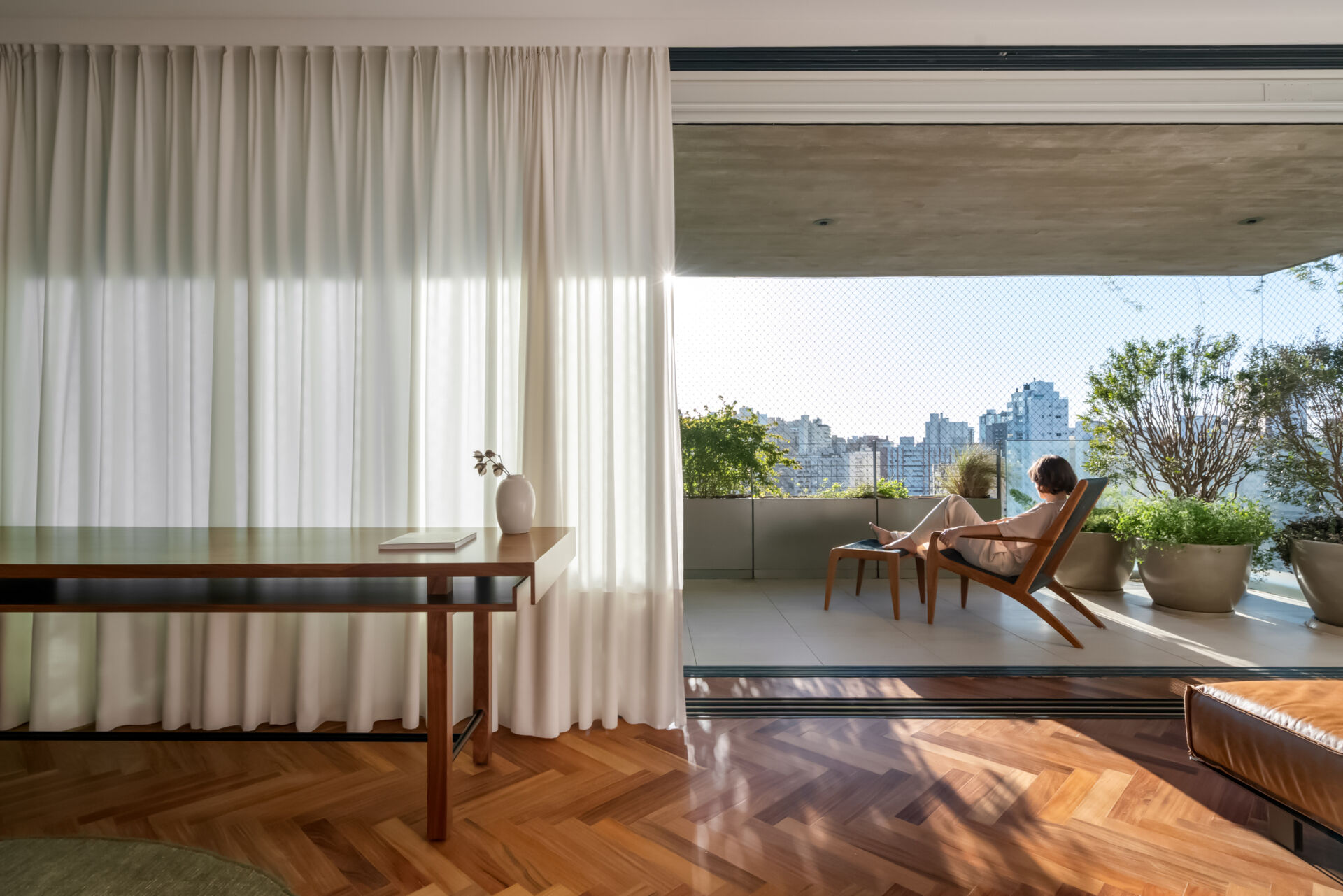 Leather-lined joinery, custom furniture and a private sitting area give this bedroom the feel of a luxury hotel suite.