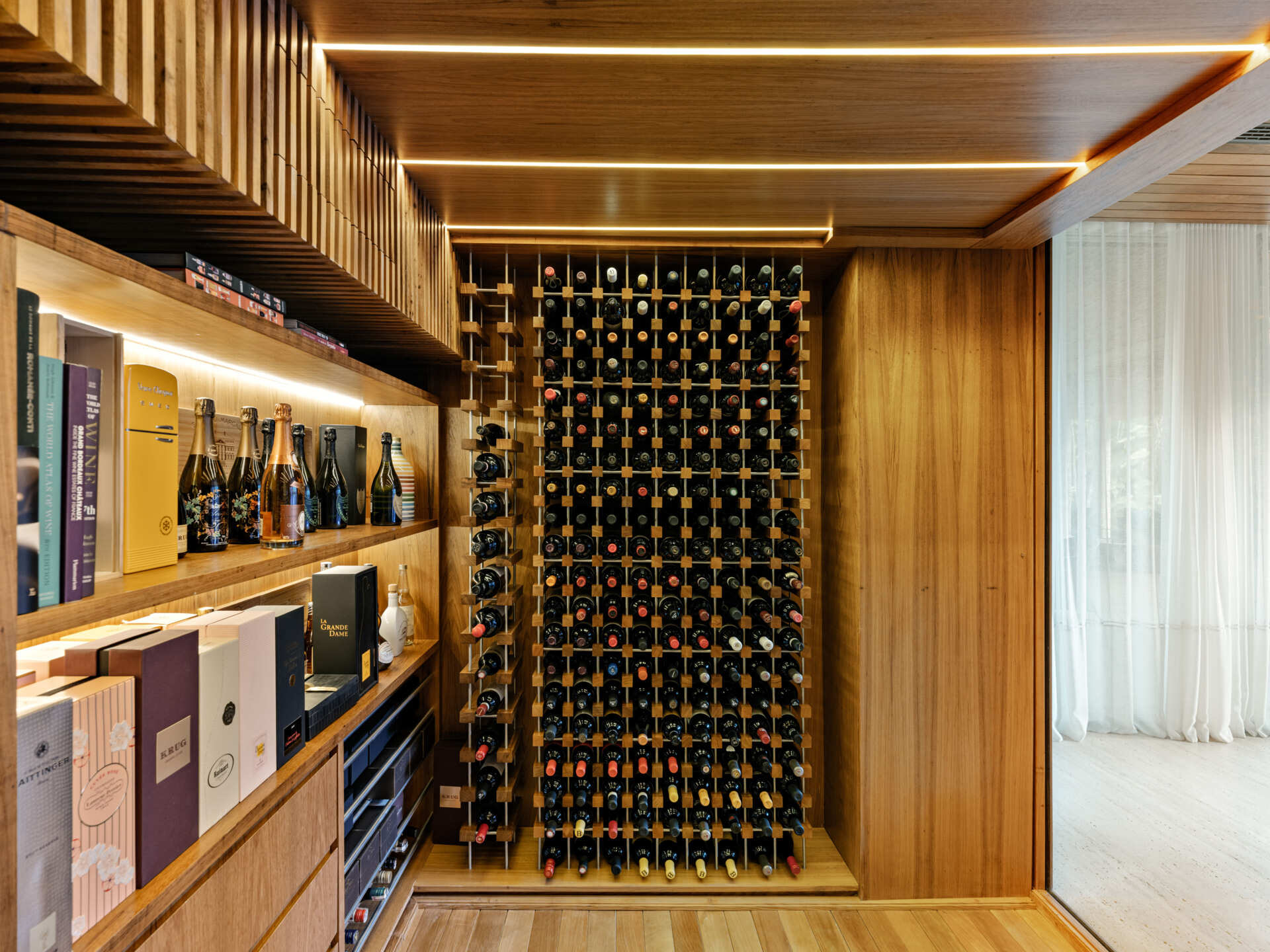This stylish wine and cigar room adds another destination within the home's open entertaining spaces.
