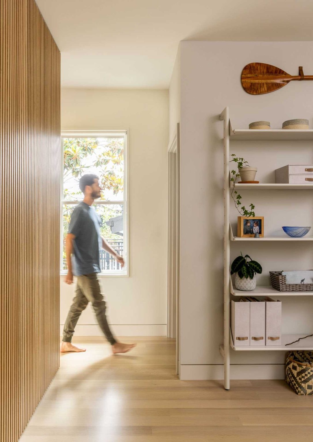 This open-plan layout combines living, dining, and a compact home workspace, showing how small homes can deliver flexible everyday living.