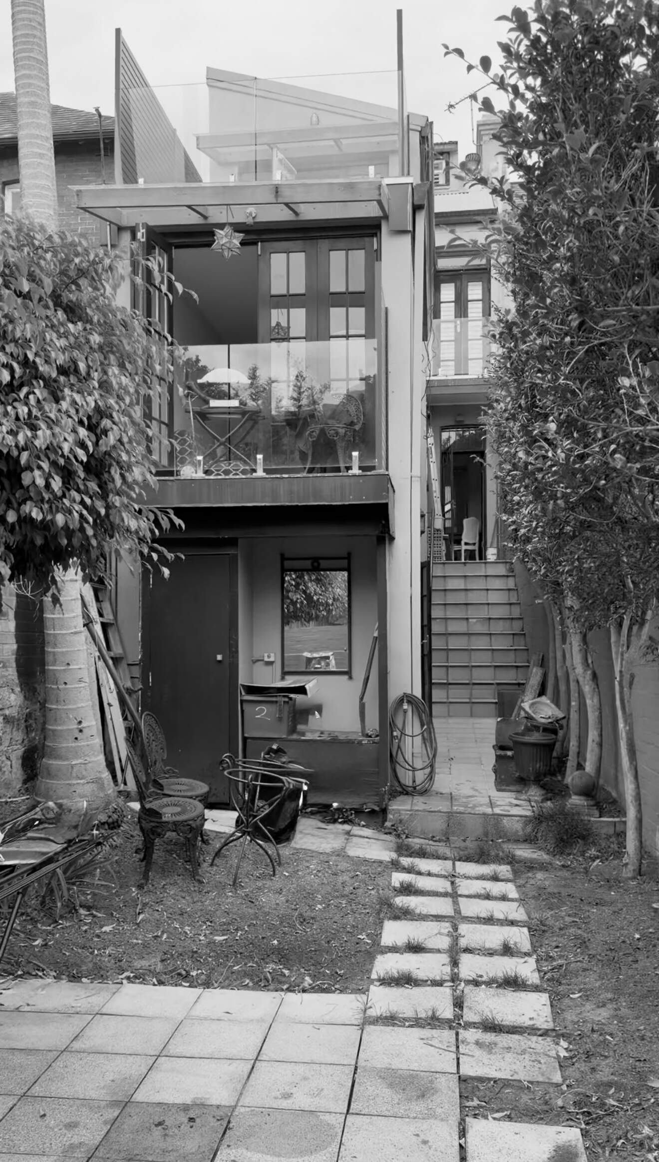 BEFORE - Discover how Noble Architecture transformed an awkward Sydney courtyard into a welcoming outdoor space with a completely reimagined layout.