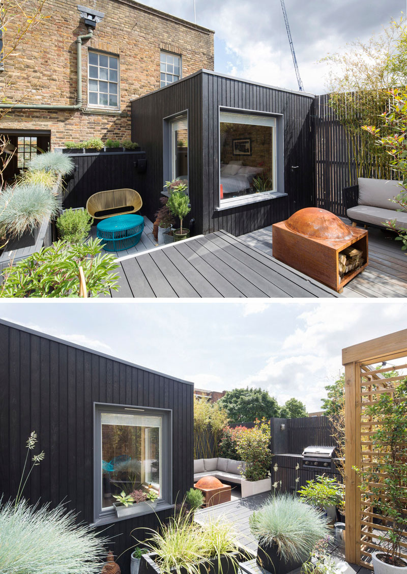 The new bedroom extension is clad in dark shou sugi ban timber, creating a strong contrast with the original brick period property.