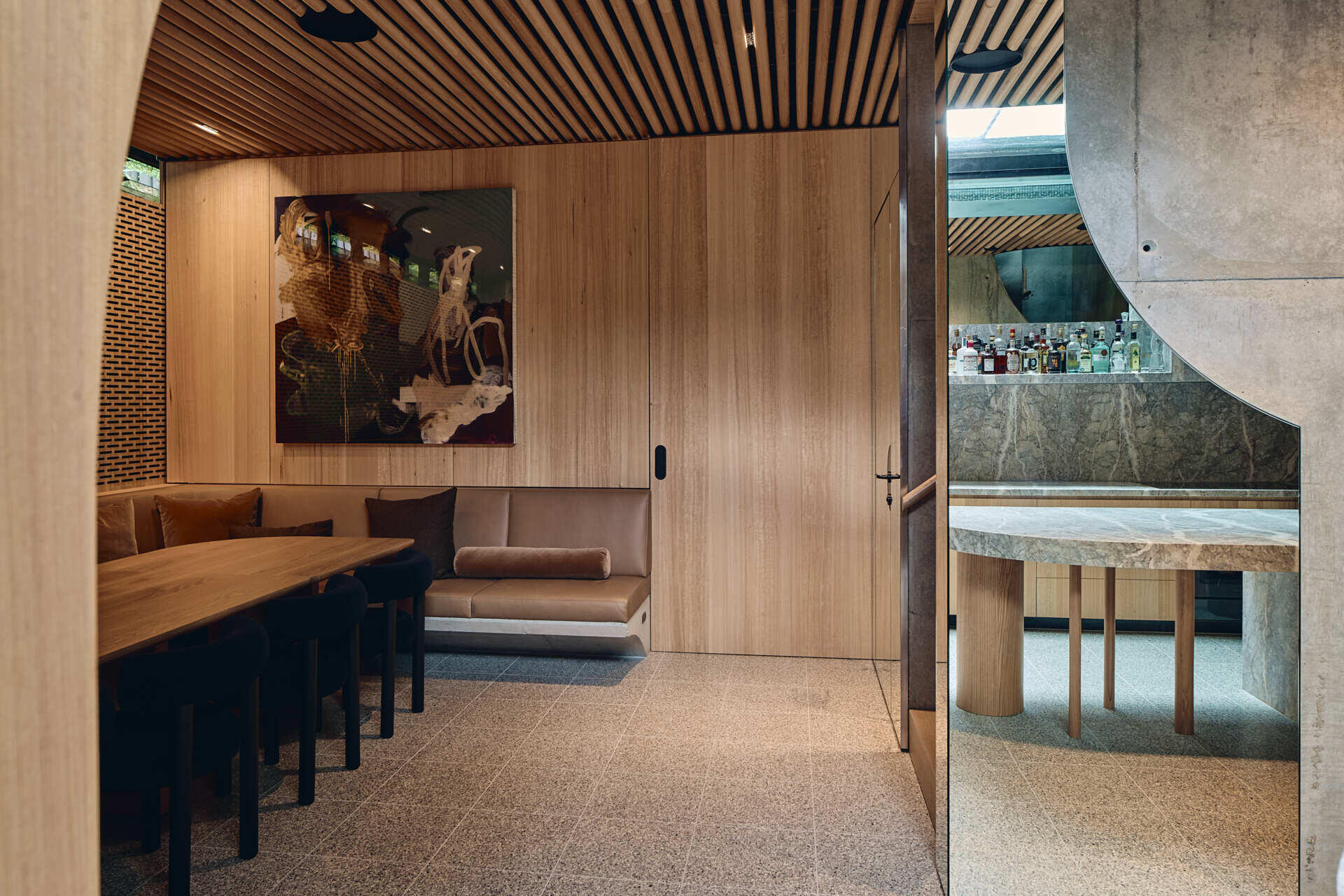 Below the garden, Babylonia's entertaining level includes a kitchen, bar, dining area and relaxed lounge