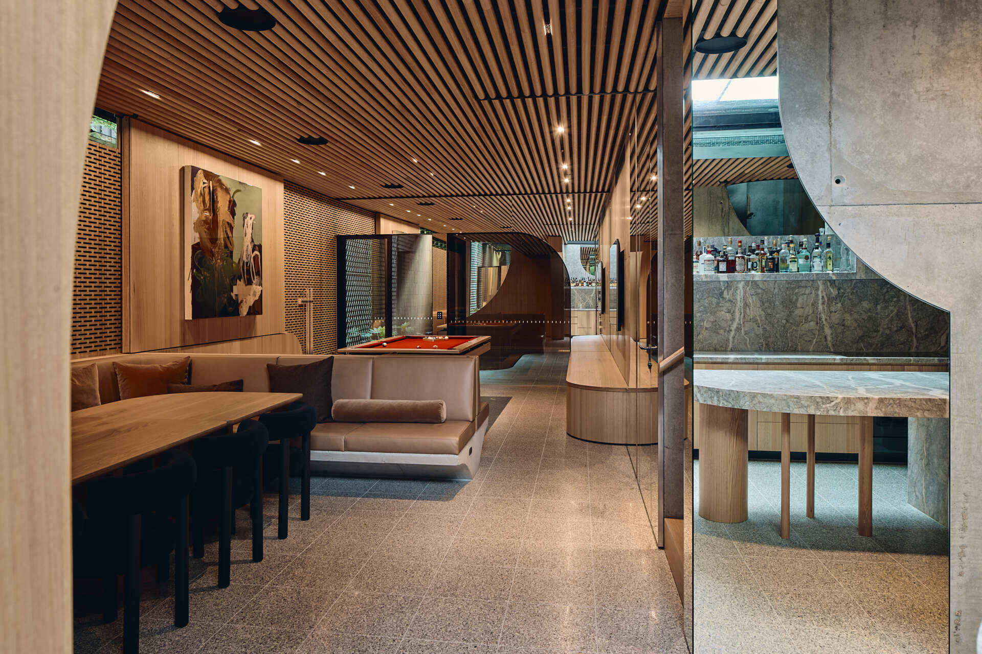 Below the garden, Babylonia's entertaining level includes a kitchen, bar, dining area and relaxed lounge