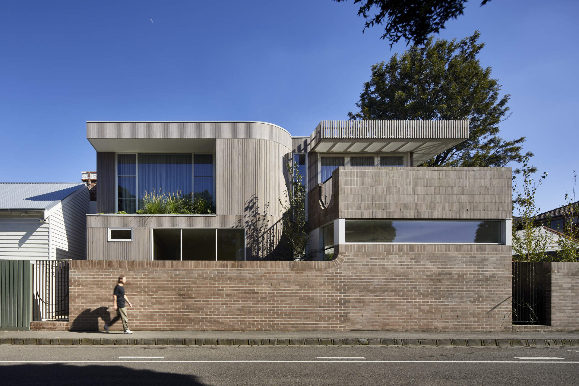 An Edwardian weatherboard cottage in Clifton Hill, Melbourne, retains its heritage character while opening into a contemporary family extension designed by Mihaly Slocombe.