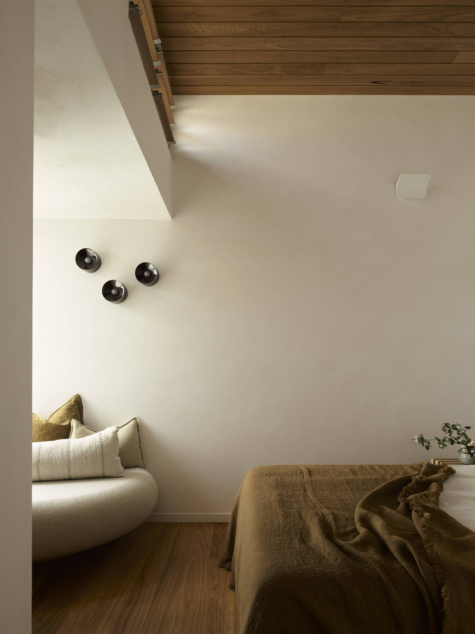 Discover the second guest bedroom in this five-level Byron Bay home, where warm timber, natural finishes and a relaxed palette create a comfortable space for family and guests.